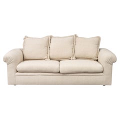 Modern Beige Upholstered Three-Seat Sofa with Throw Pillows