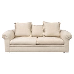 Modern Beige Upholstered Three-Seat Sofa with Throw Pillows