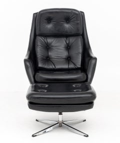 Overman Button-Tufted Black Vinyl Swivel Lounge Chair and Ottoman