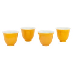 Set of Four Chinese Yellow Glazed Porcelain Tea Bowls