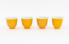 Set of Four Chinese Yellow Glazed Porcelain Tea Bowls