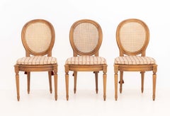 Set of Six Louis XVI Style Cane-Paneled Walnut Dining Chairs