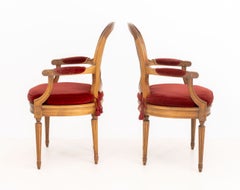 Pair of Louis XVI Style Red Velvet Upholstered Cane Paneled Walnut Fauteuils