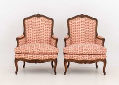 Pair of Louis XV Style Red and White Fabric Upholstered Walnut Bergeres