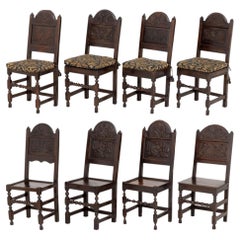 Set of Eight Jacobean Floral Motif Carved Oak Dining Chairs