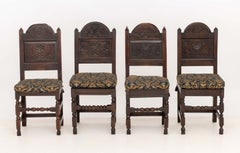 Set of Eight Jacobean Floral Motif Carved Oak Dining Chairs