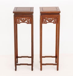 Pair of Chinese Hardwood Mythical Beast Motif Pedestal Stands