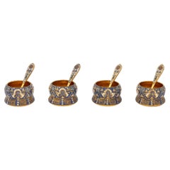 Set of Four Silver Gilt and Polychrome Enameled Open Salt Cellars and Spoons