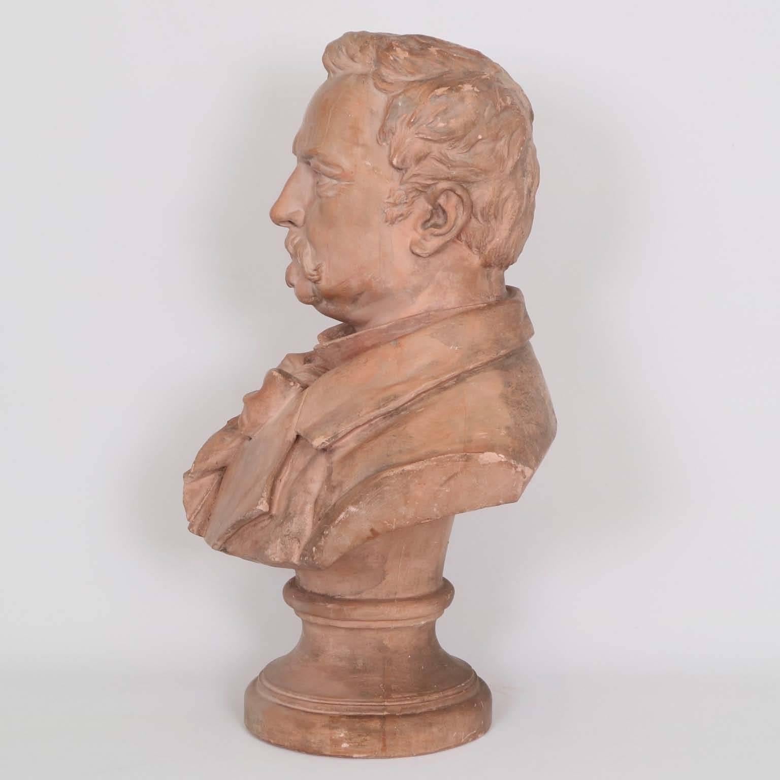A French 19th century terracotta bust of novelist Victor Hugo, signed and dated [Jivoy, 1883] to the right shoulder by the artist. This piece remains in very good antique condition, wear consistent with age and use.