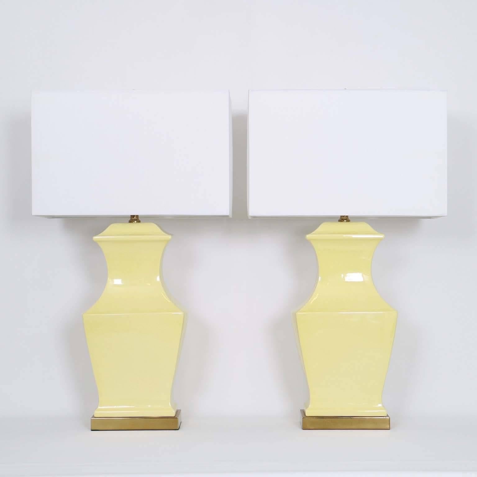 Pair of ceramic squared baluster lamps by Paul Hanson, mounted on brass bases. The noted height is to the finial; the height of the ceramic body is 17 in (43 cm). Very good vintage condition, wear is consistent with age and use. Newly