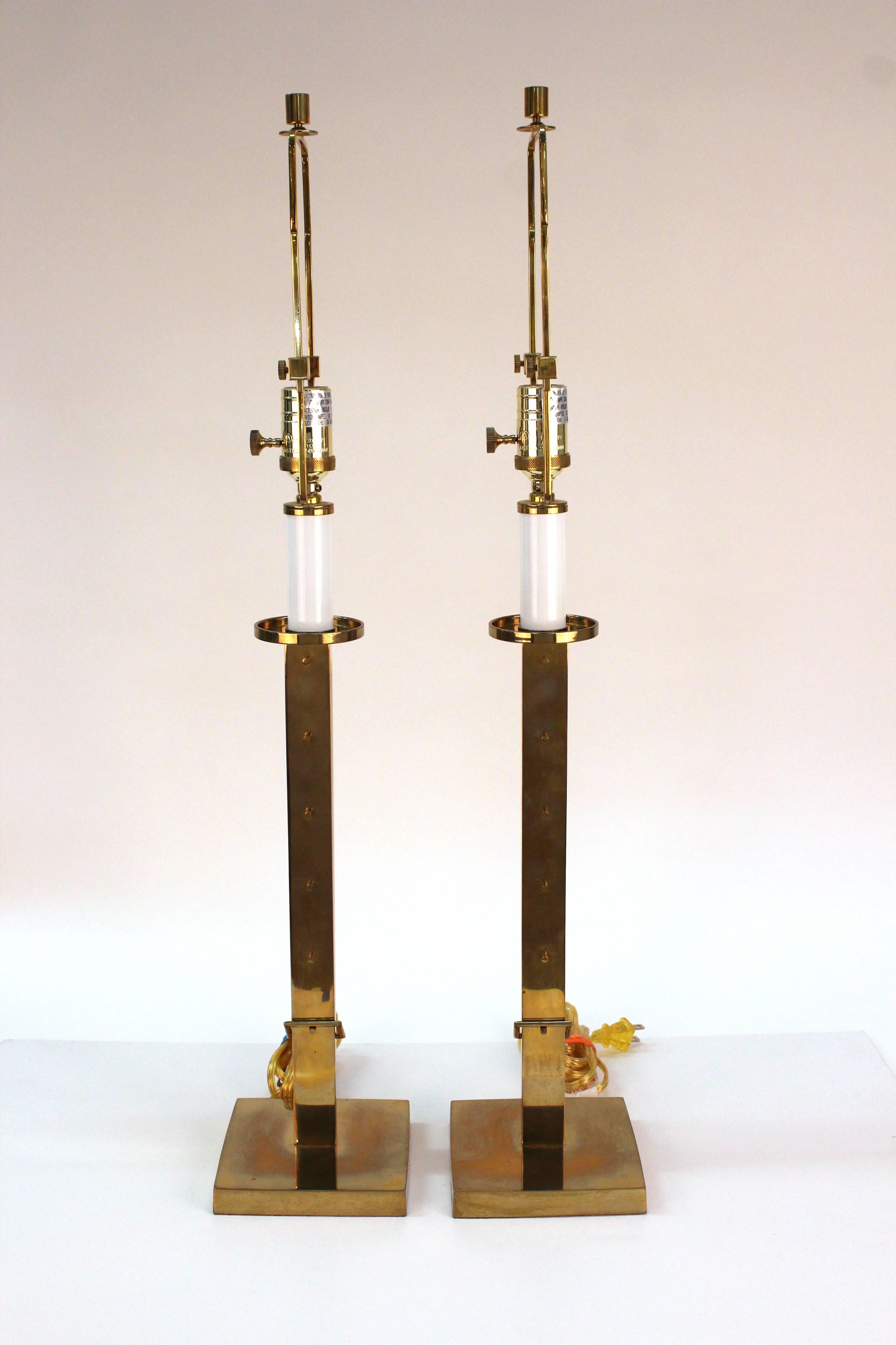 A pair of polished brass table lamps produced by Ralph Lauren with ratcheted stems.

110496