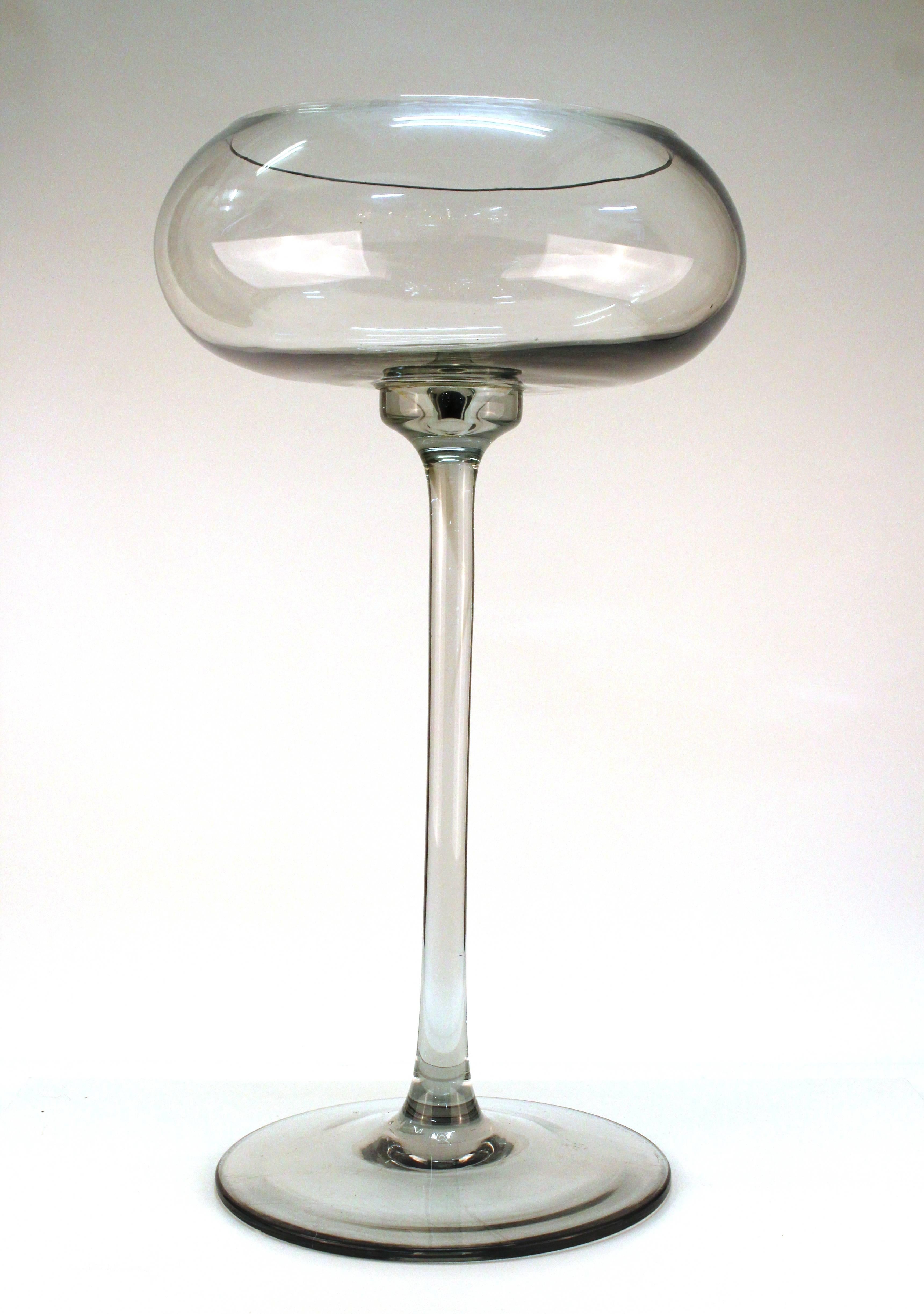 A large cocktail glass on a round base. Featuring a round deep cup perfect for using as an ice bucket or statement piece. The glass is in good condition.