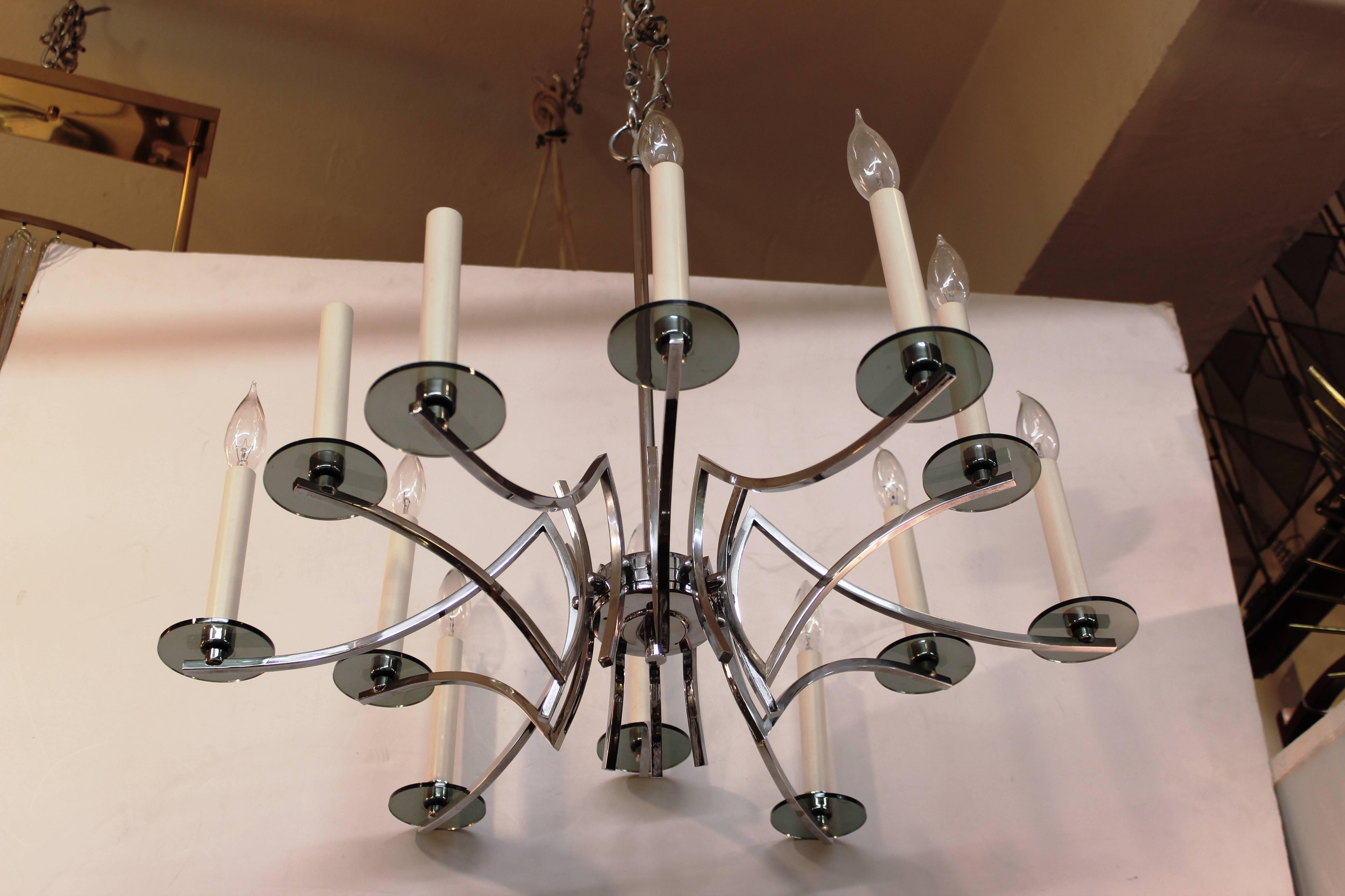 A twelve-arm chrome frame chandelier with smokey Murano glass detailing. The piece was made in Italy in the 1970s and is in great vintage condition.