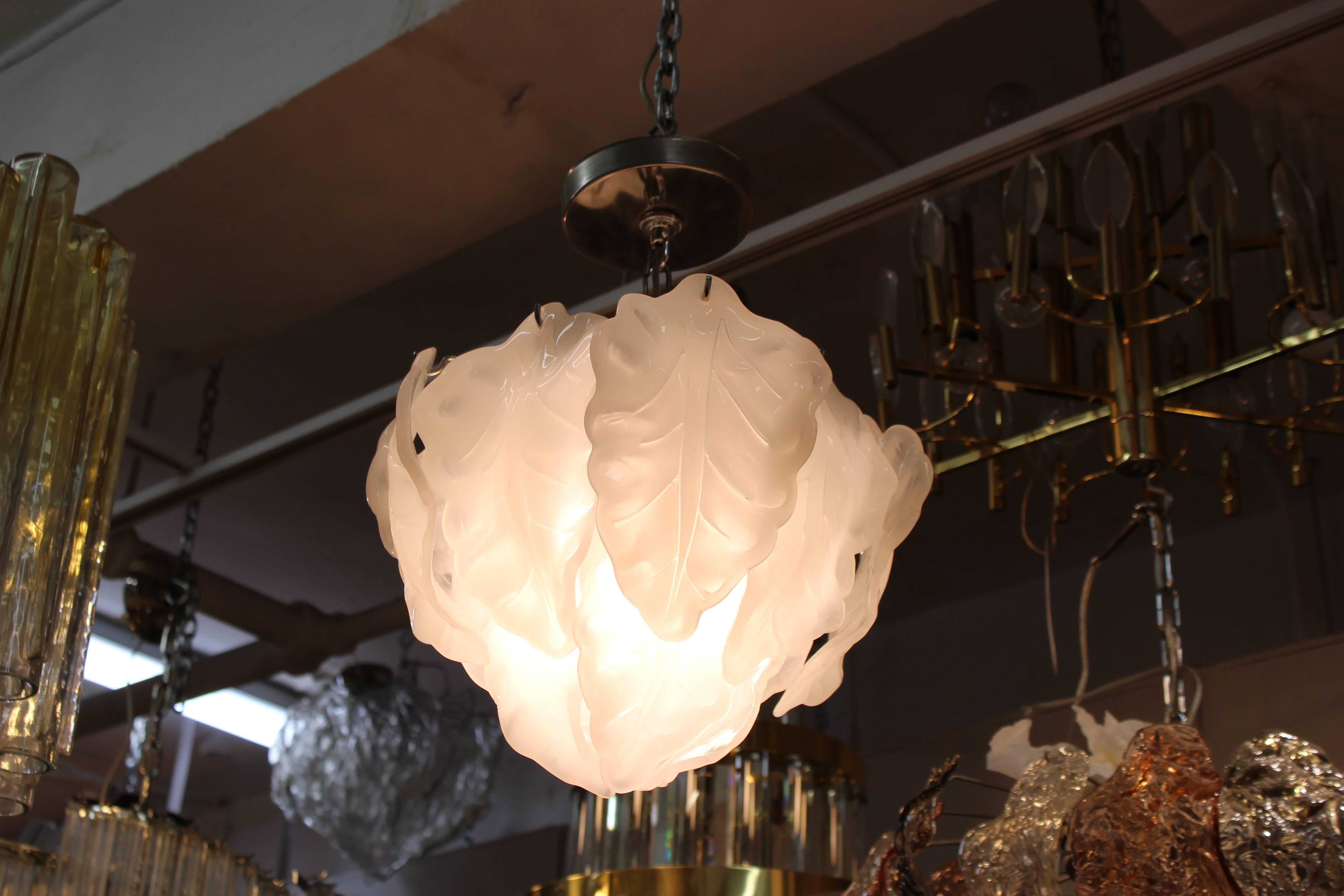 A Mid-Century Modern Murano glass pendant with white leave shaped elements. The piece was made in Italy in the 1970s and has recently been rewired to US standards.