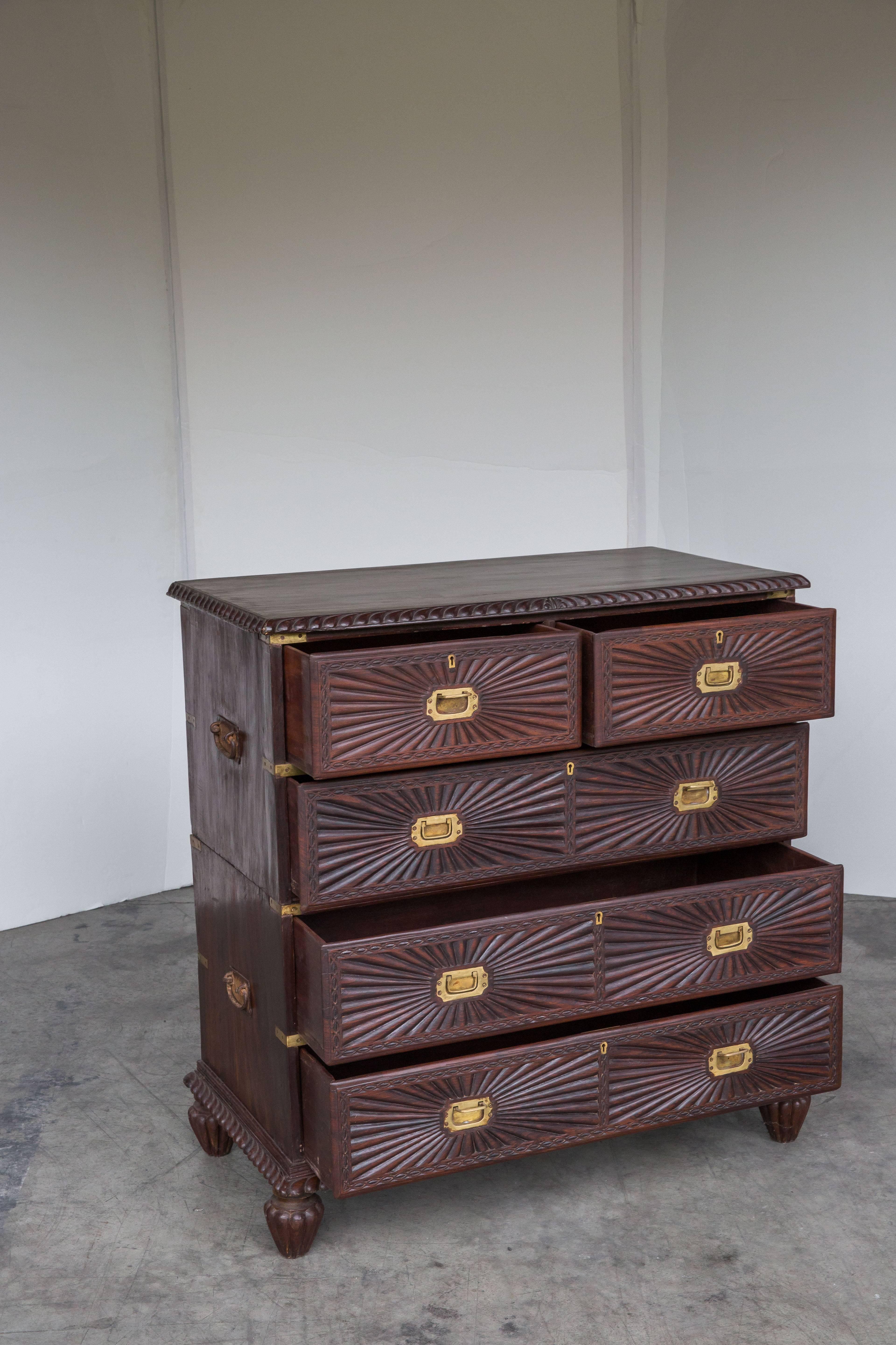 Indo-Portuguese rosewood chest of drawers with sunburst pattern and brass drawers. The unit separates into two sections (Campaign style meant for easy transport). The handles on the sides are original and it shows (very patinated).
