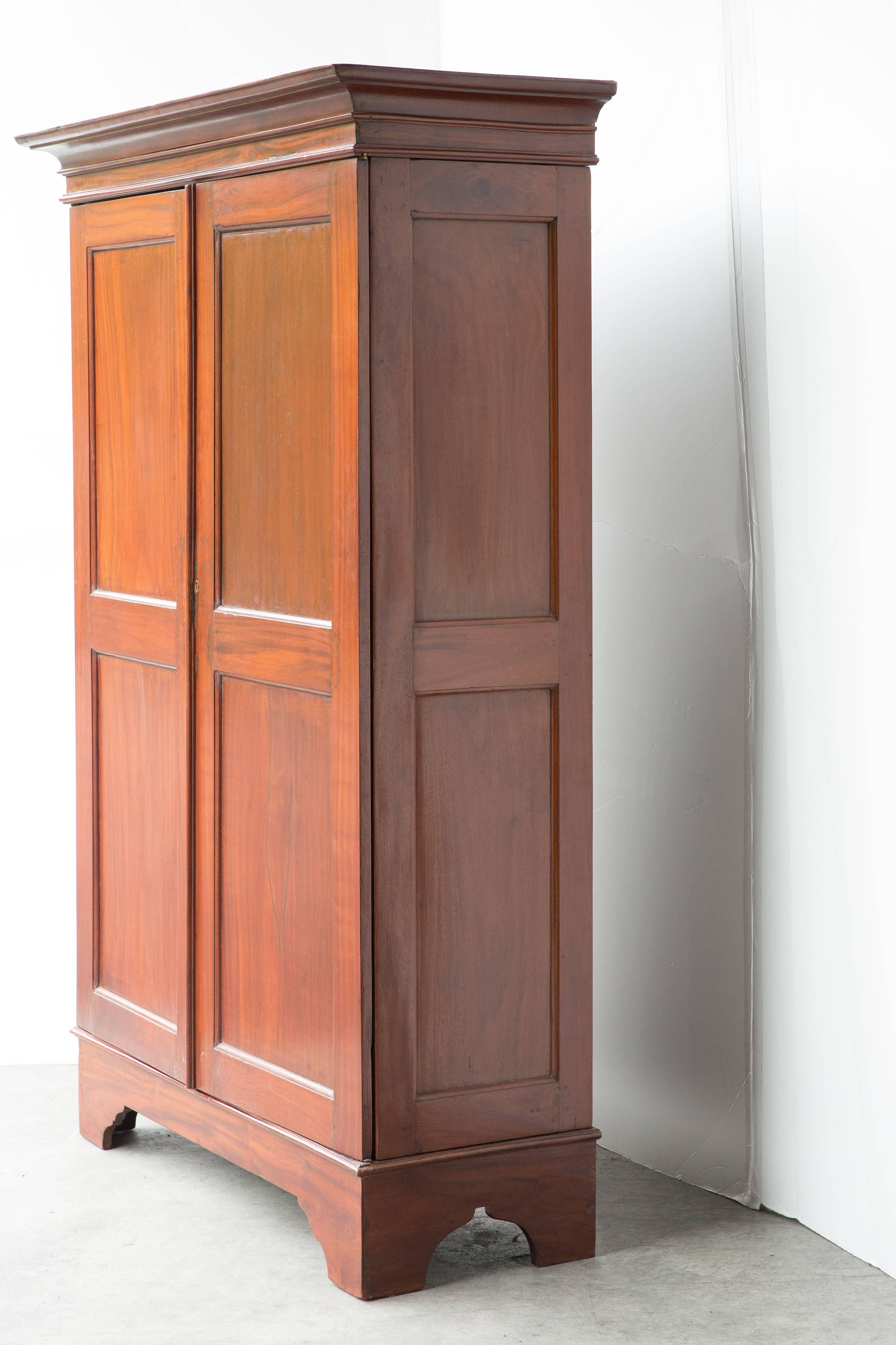 Dutch Colonial solid jackfruit wood armoire with three removable shelves. Armoire breaks down flat for transport. There is a second one as well that is the same footprint but slightly different design on the doors. 

Interior dimensions:

46