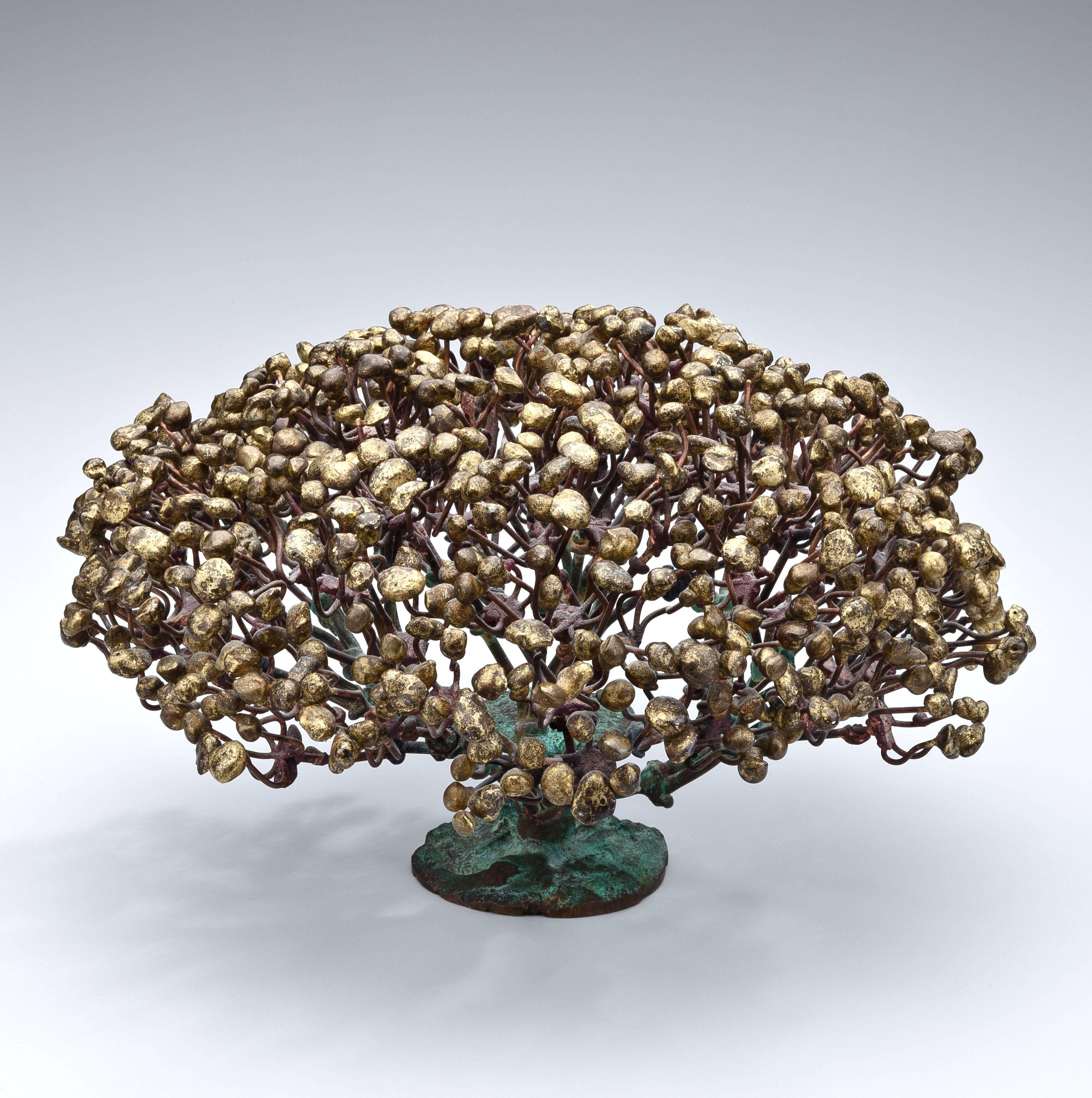 A gilt bronze bush sculpture by Harry Bertoia (1915-1978) highlighted by gold and red patina creating colorful contrasts. The gilt wire branches radiate out from the pipe stem base culminating in gilt bronze buds each individually soldered to its