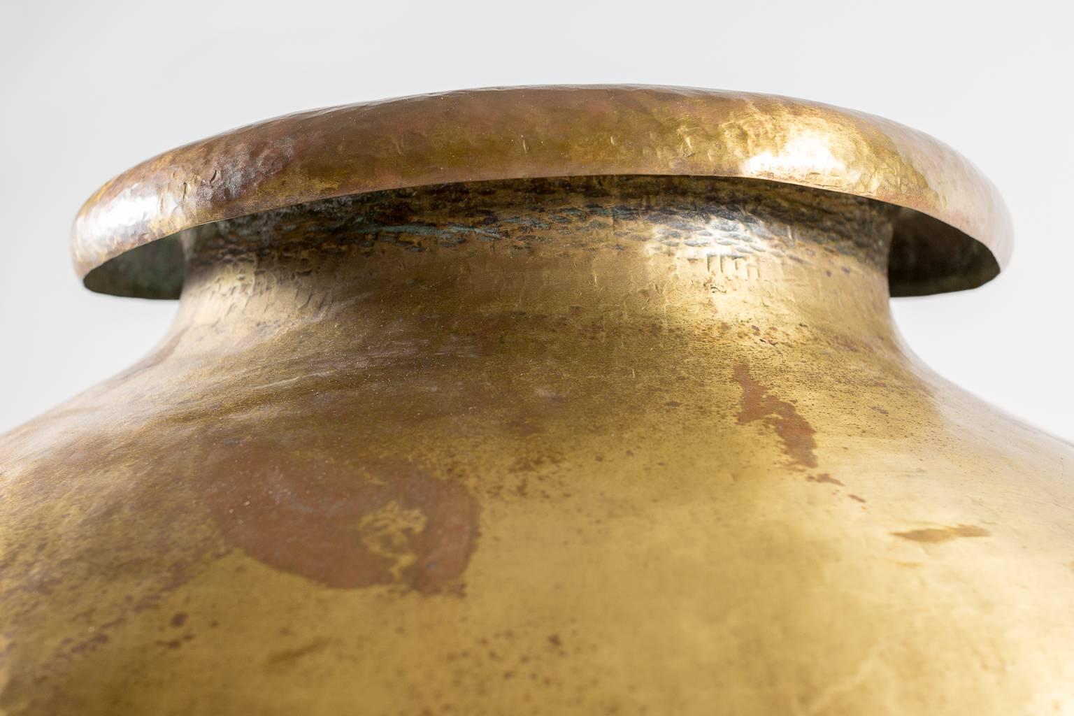 India water vessel also called a Lota Pot was used to store water in India and local regions. It was hand-forged of a bronze and brass alloy. It has marked by artist.
Beautiful patina would make handsome vase for floral or reeds. We love this pot!