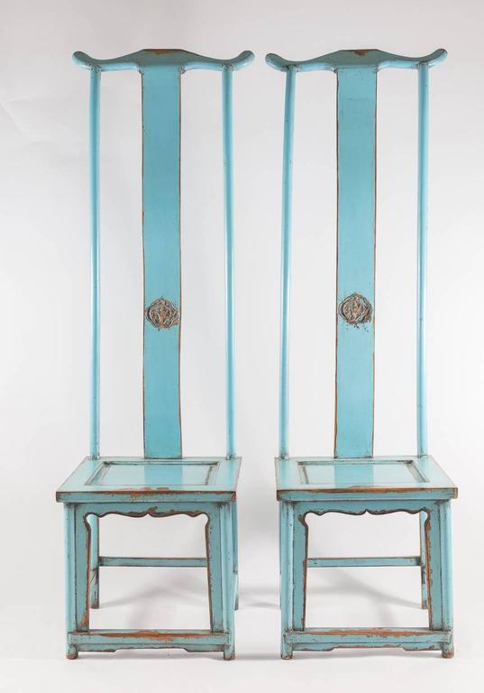 Beautiful tall pale blue chairs made for tall hat officials. Yolk back detail at top.
Good luck symbol painted in gold paint or gold leaf, chairs trimmed in same color.
From Shanghai.