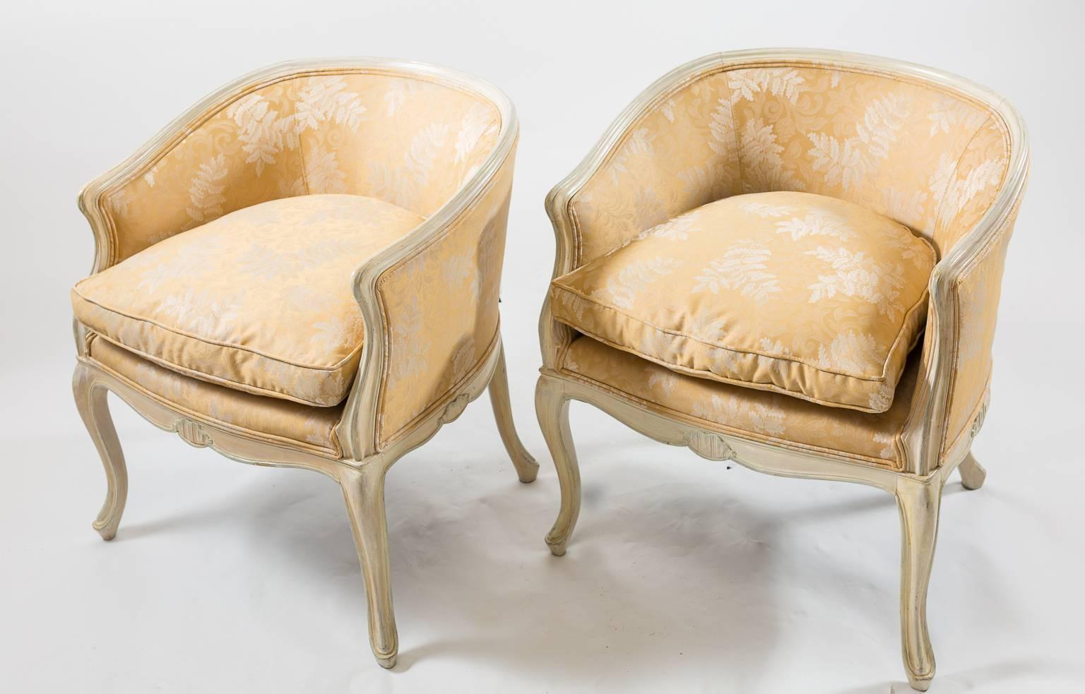 Louis XV chairs, cabriole legs, carved fruitwood cream colored frame with shell motif, beautifully reupholstered (edged ogee) which looks to be pale silk fabric with white fern print on chairs and cushions.