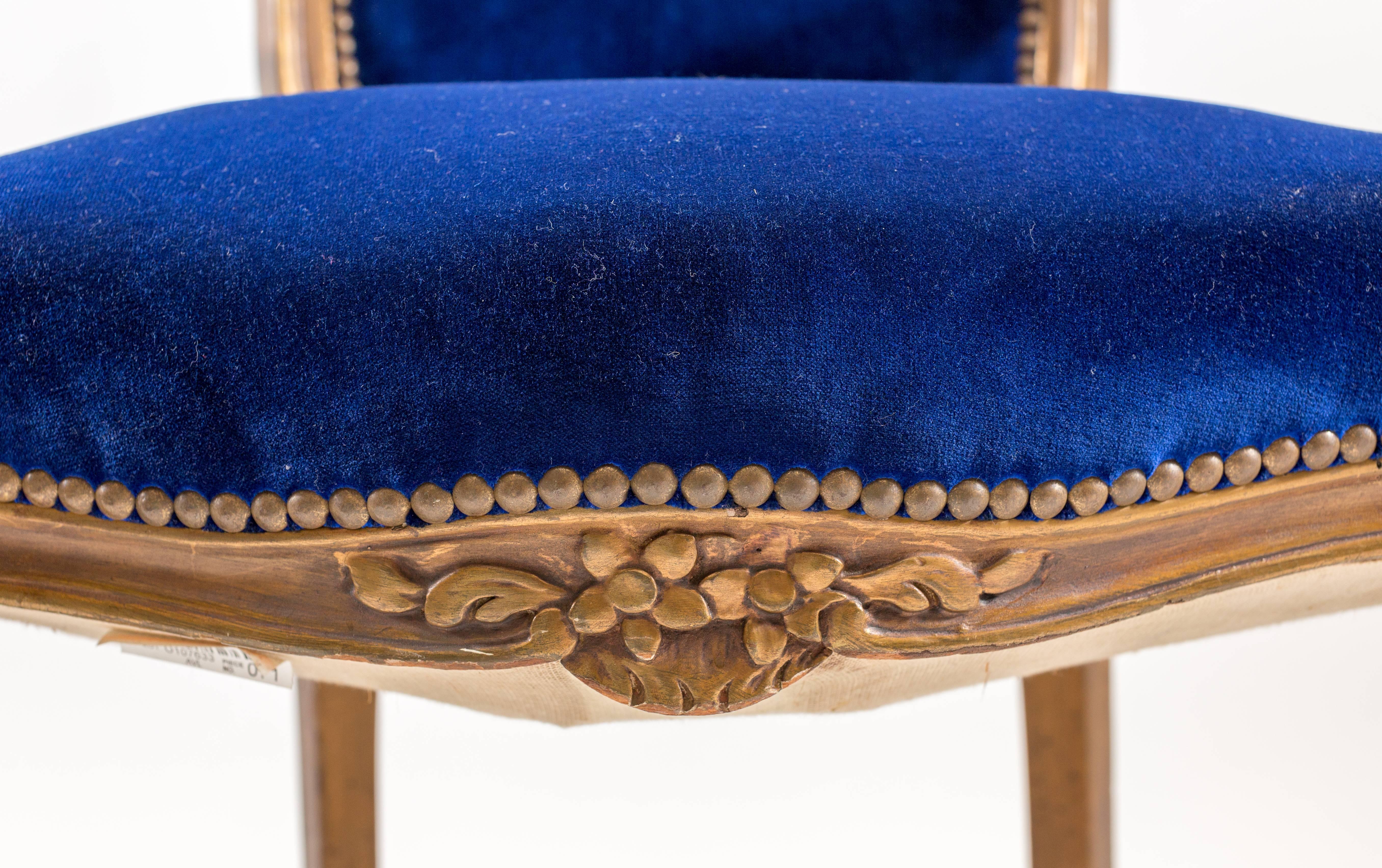 Carved Pair of Cobalt Blue Velvet Louis Bergere Padded Armchairs