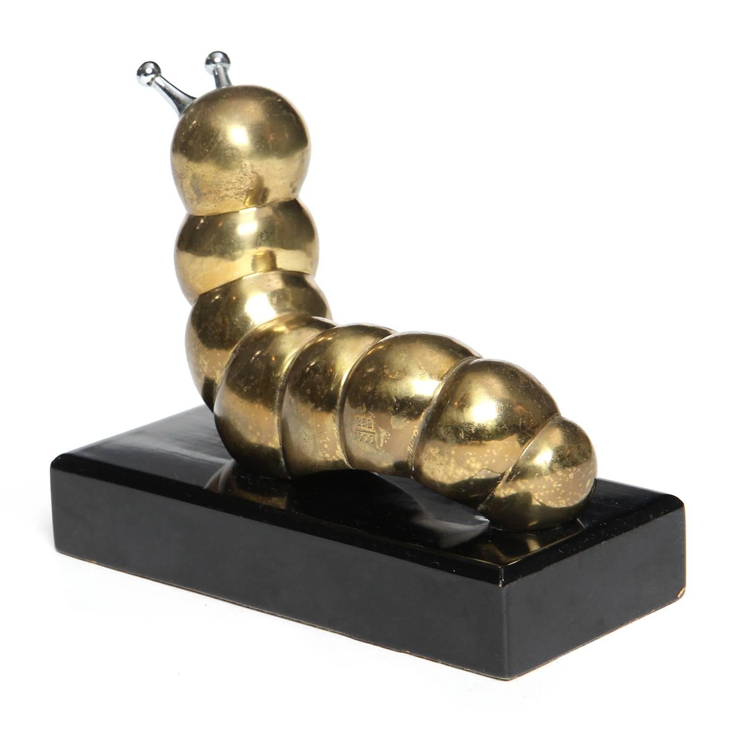A delightful and unusual bronze and steel sculpture depicting a plump segmented caterpillar.