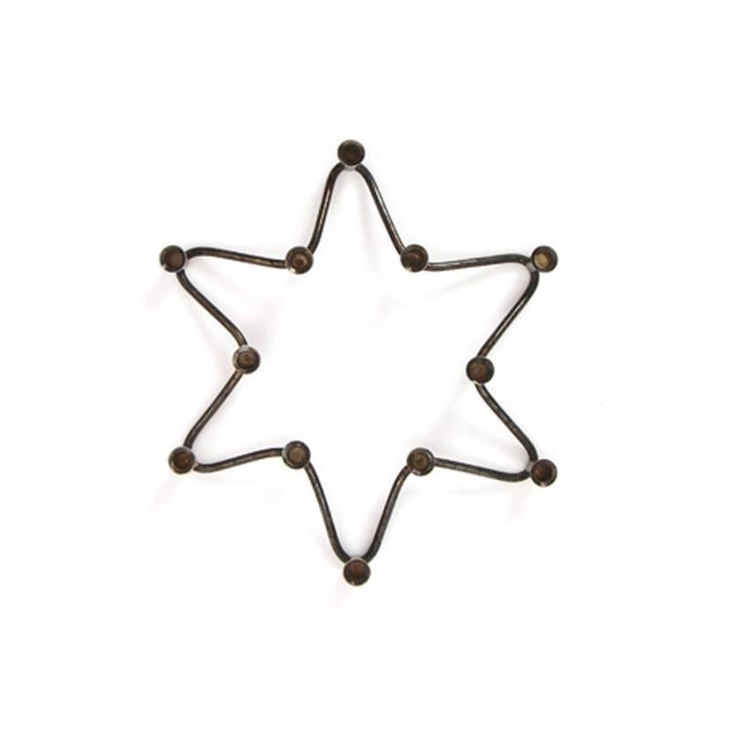 A Danish taper candleholder in the shape of a star.