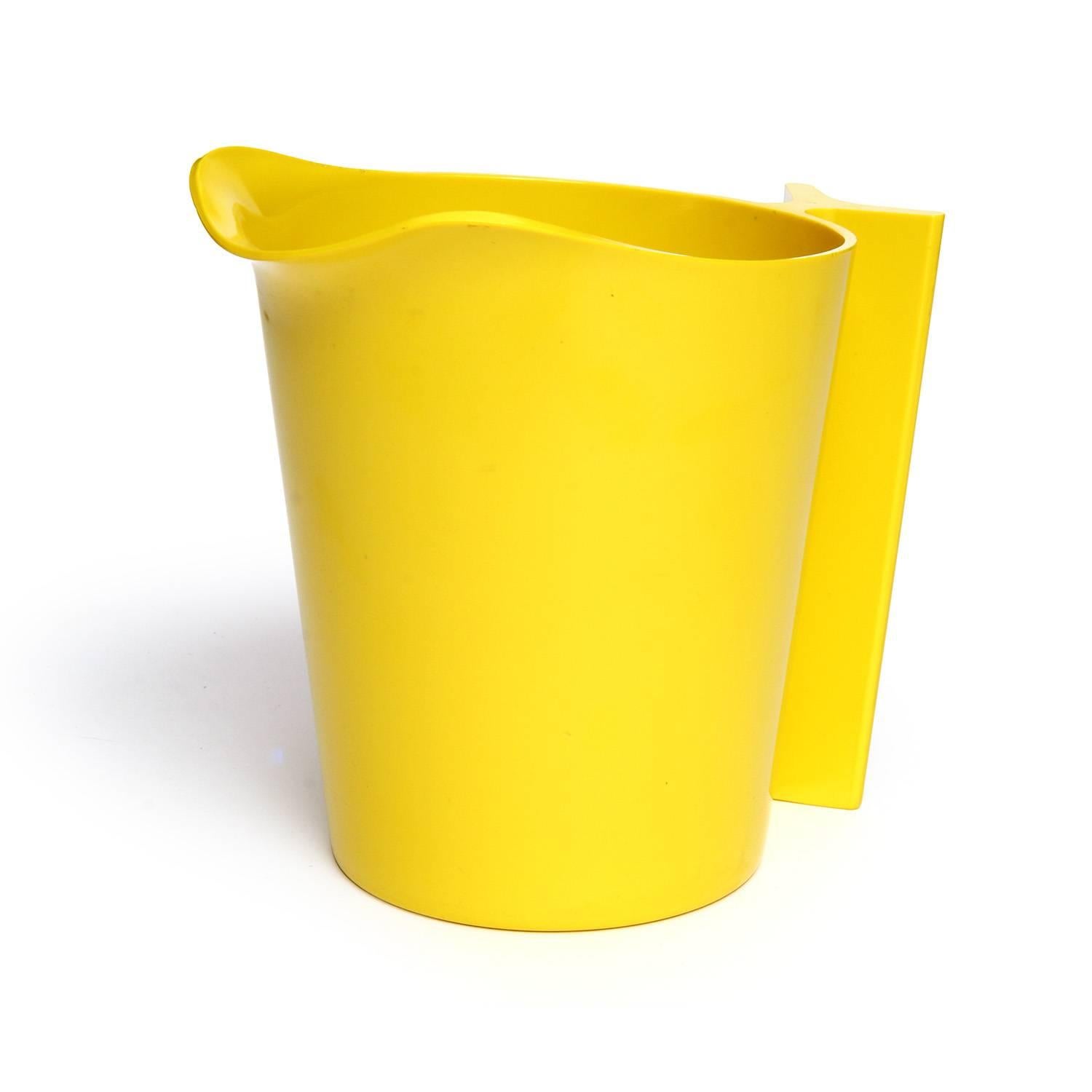 A refined and sculptural set of 5 salad bowls with a serving bowl and utensils crafted in a vibrant yellow plastic.