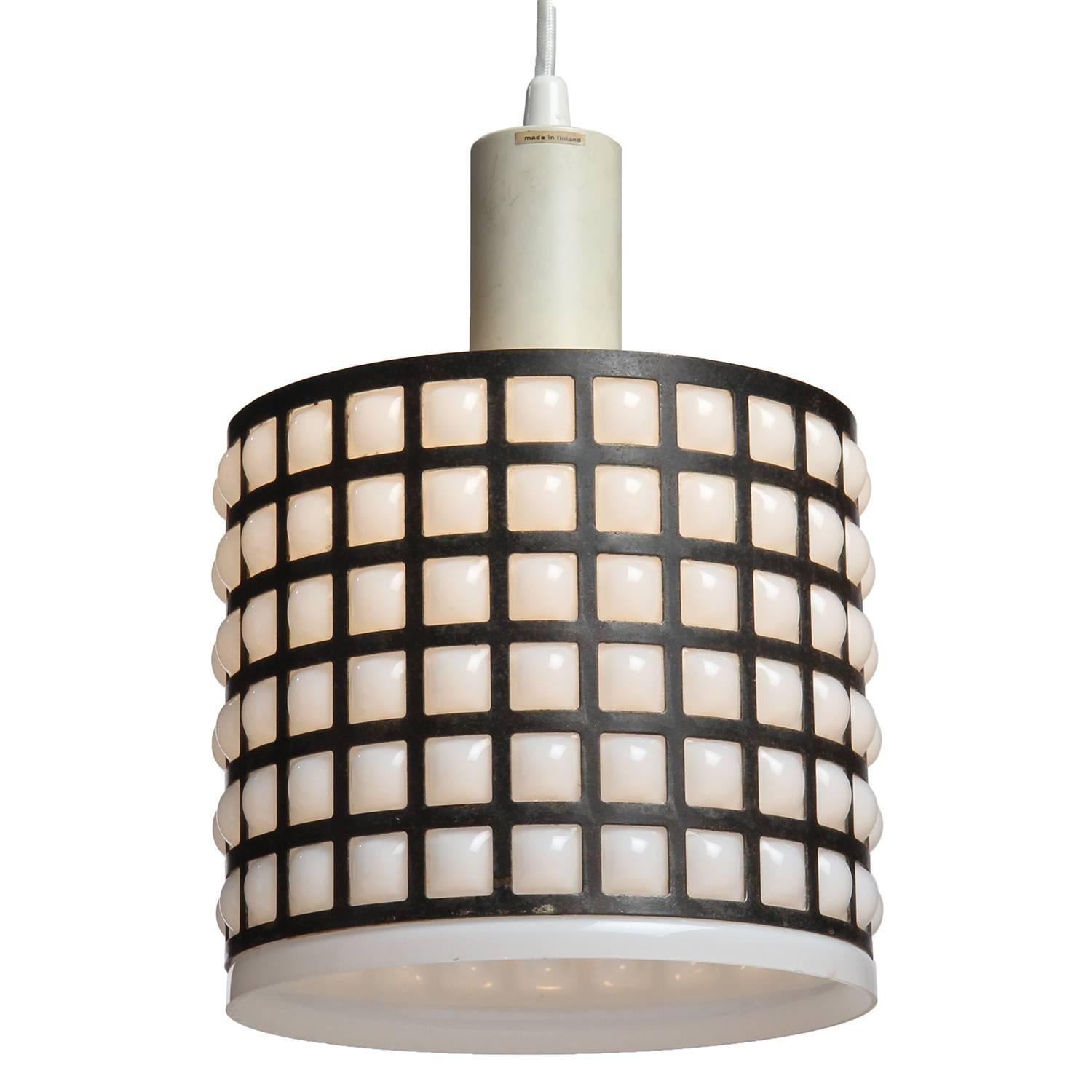 A graphic and unusual cylindrical ceiling fixture having a white glass shade blown into a patinated bronze grid.