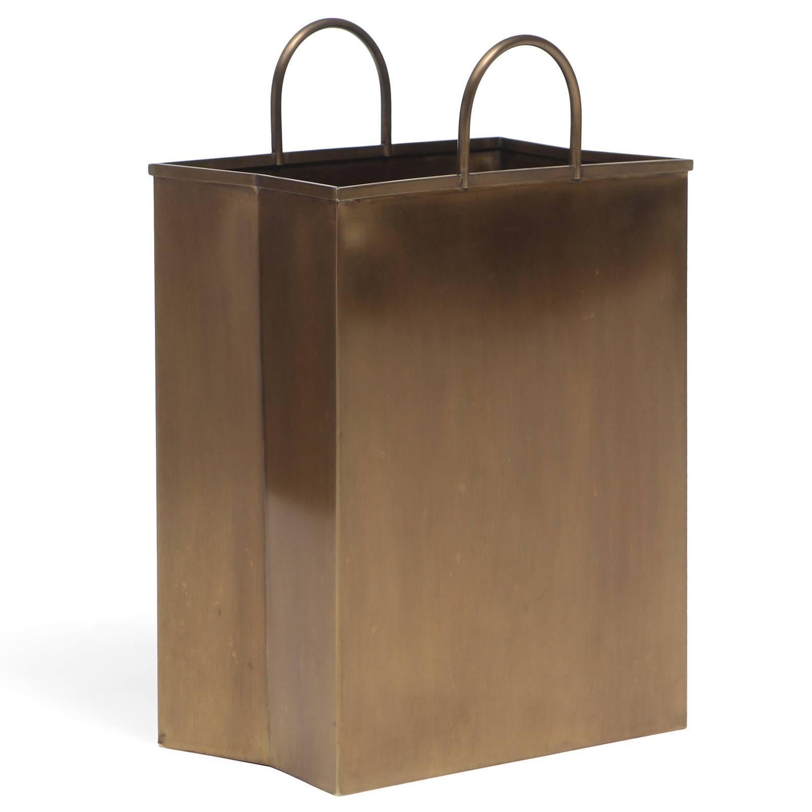 An expressive and finely constructed brass waste baskets in the form of pleated shopping bags. Small basket is 6.5