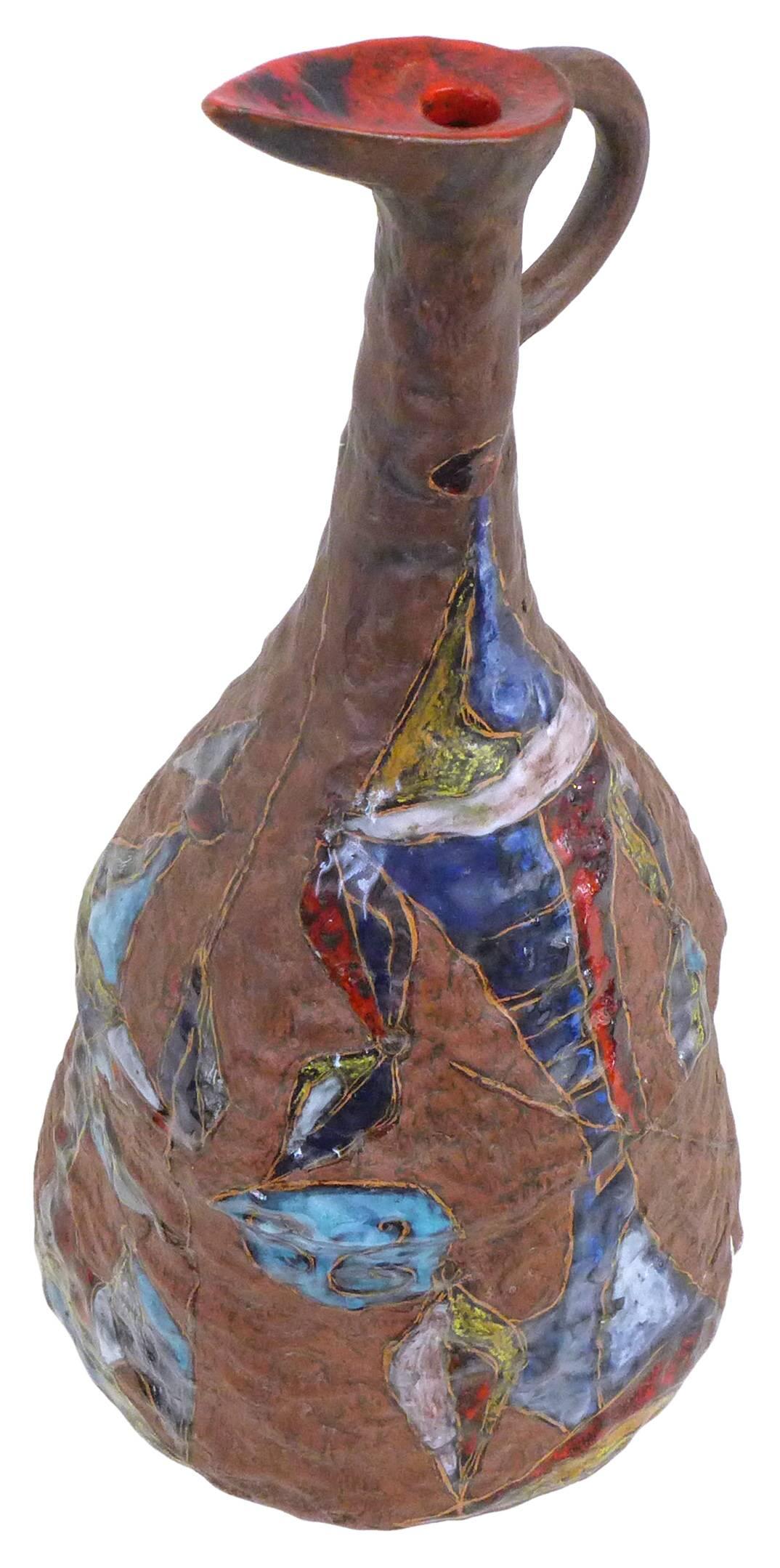 An exceptional ceramic pitcher by acclaimed Italian ceramicist Marcello Fantoni. A hand-built, textured, earth-toned vessel decorated with two cubist gondoliers in a multicolored, high-gloss glaze and a burst of red at its mouth. Great scale and