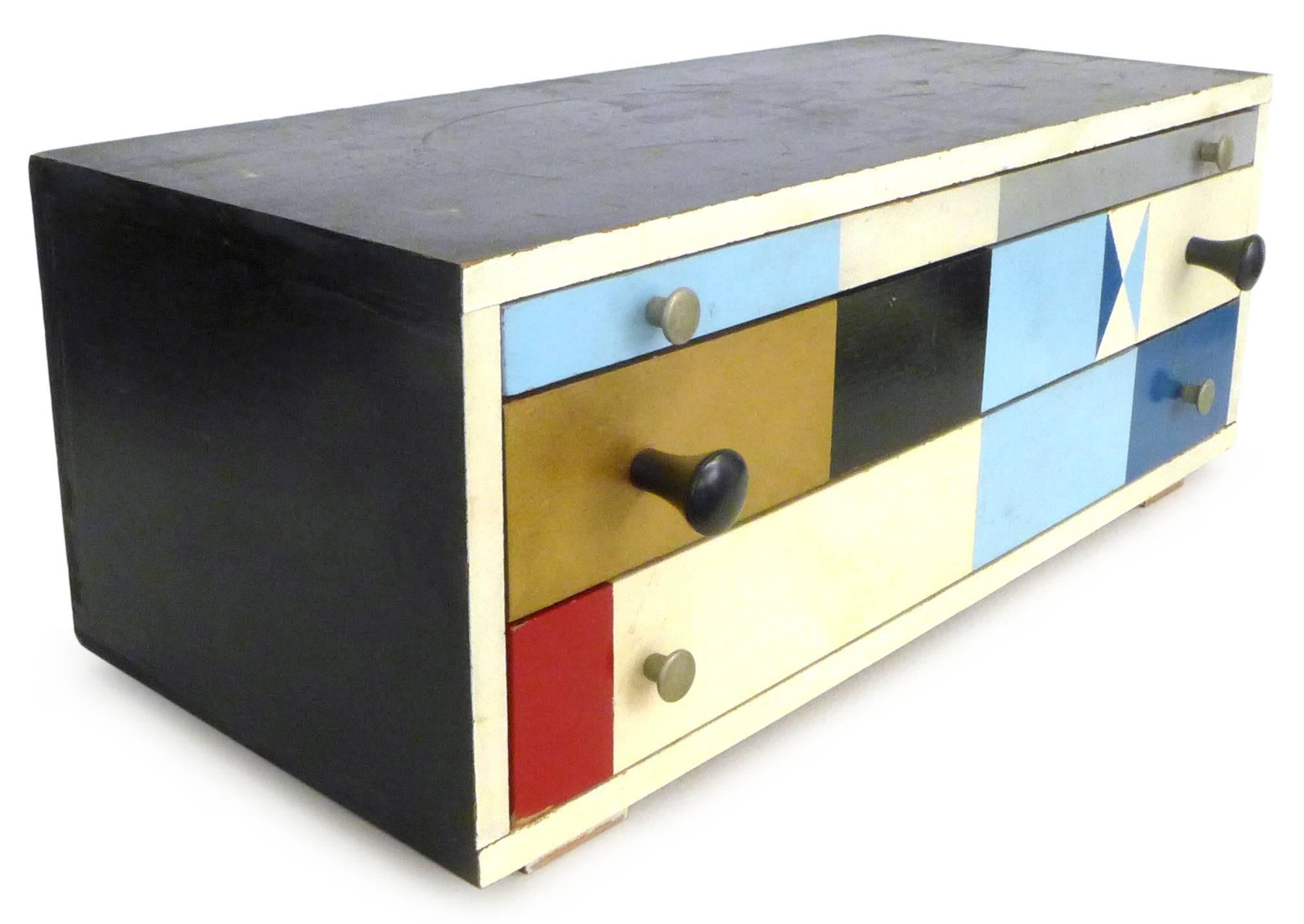 A fantastic, hand-painted wood jewelry box. Beautifully built by a Cranbook Schools professor, a wonderful fusion of Mid-Century Modern aesthetic and Folk Art construction: A simple, carefully and exactly-executed structure of clear