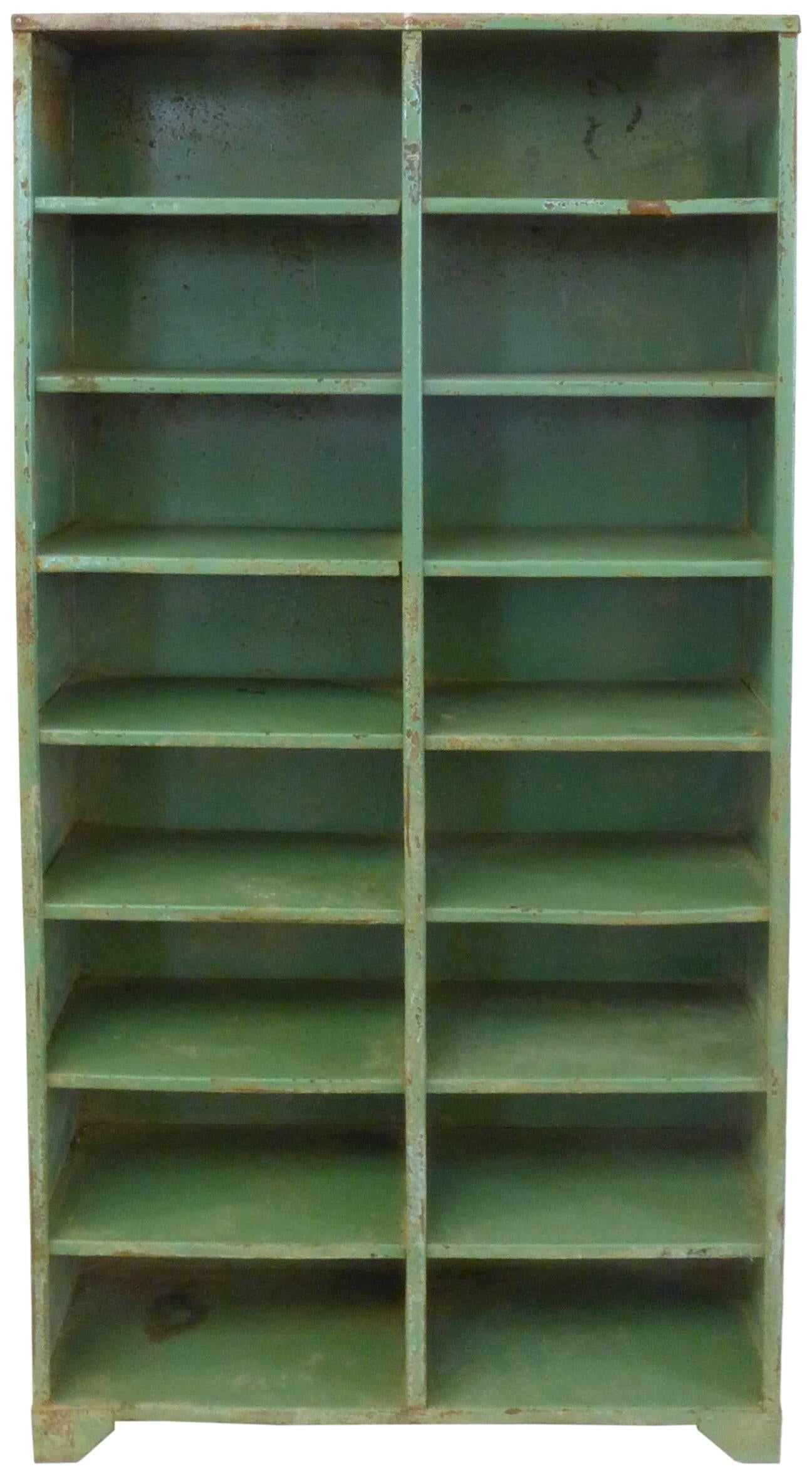 An outstanding 1930s French Industrial shelving unit. Great scale and modernist simplicity in design, this welded-steel unit wears a beautifully worn, enameled Prouvé-green; a much desired patina of oxidation and other wear-and-tear from years of