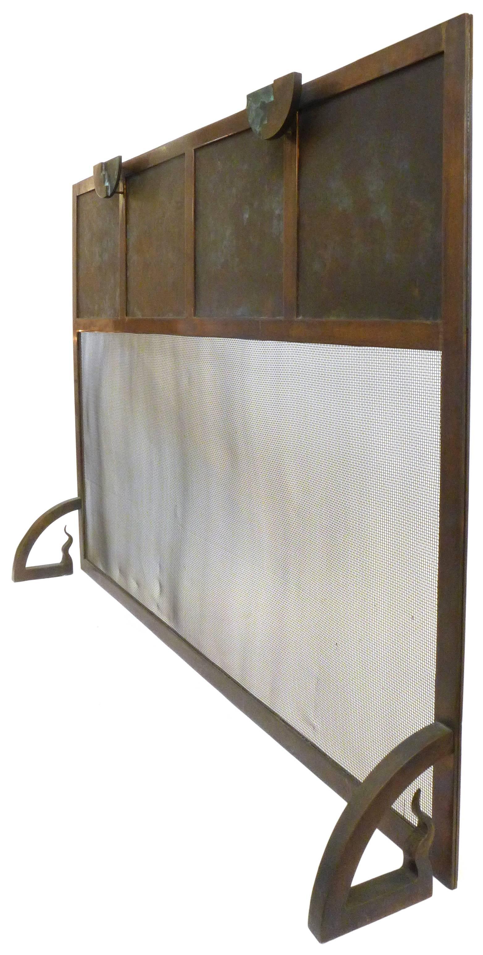 A fantastic Machine Age inspired bronze fire screen. A remarkable piece of great presence and subtle detail with demilune, stair-step handles and stylized 