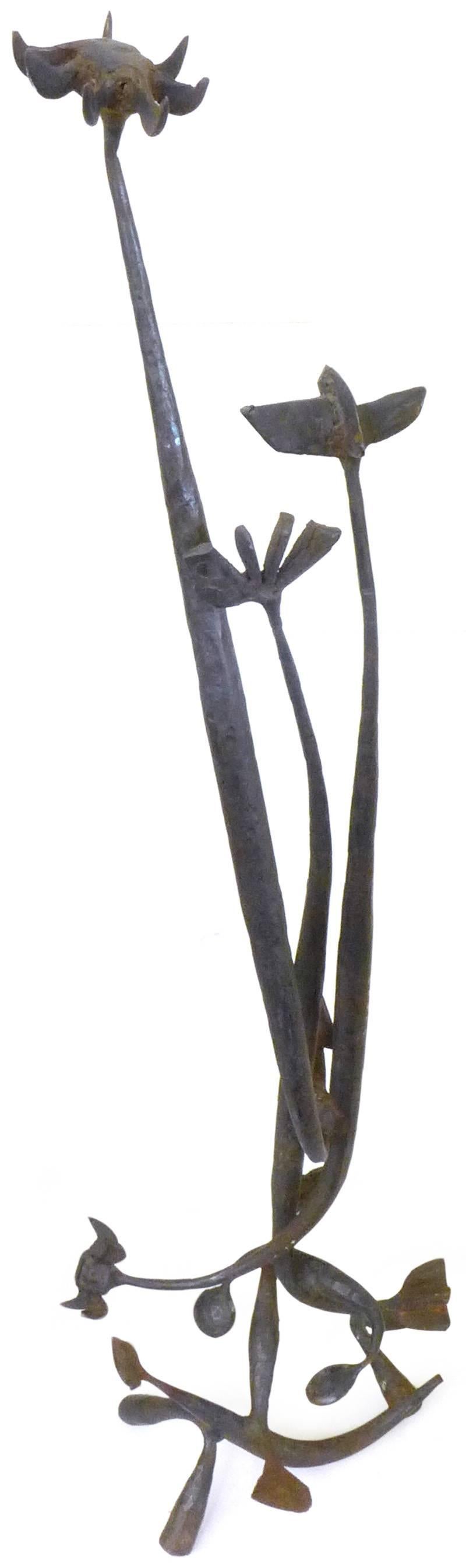 An incredible, Brutalist, wrought iron sculpture. Impressive and beautifully-executed, a towering cluster of stylized botanical elements welded together, wearing scattered, hand-worked texturing. Great from all angles and exuding a distinct Kinetic