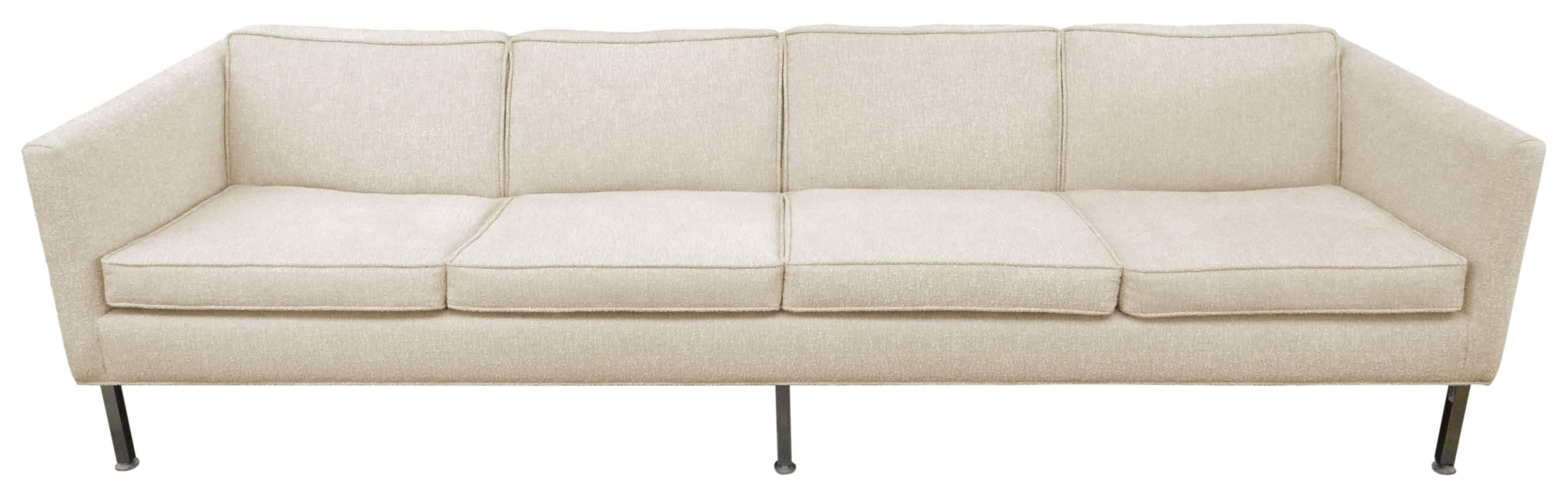 A fantastic, four-seat sofa by Metropolitan Furniture Company of San Francisco, CA. A beautifully simple, Minimalist piece of exceptional scale and Classic, Mid-Century sophistication; a low, sleek profile with six square-stock, chromed legs, the