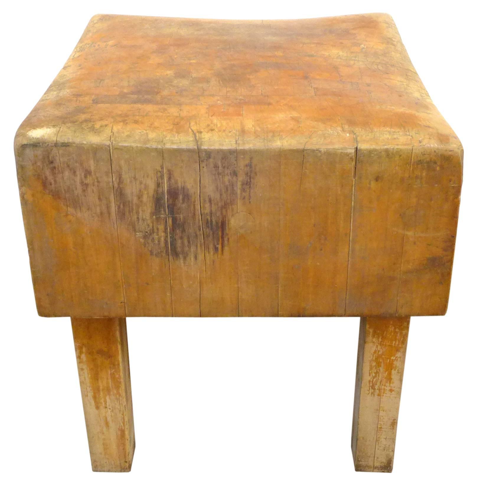 An incredible, vintage, wood butcher-block table. Hailing from a Los Angeles market opening in the 1930s, an unbelievable piece, beautifully worn from years of use. The top surface revealing great craftsmanship in its intricate dovetail joinery. The