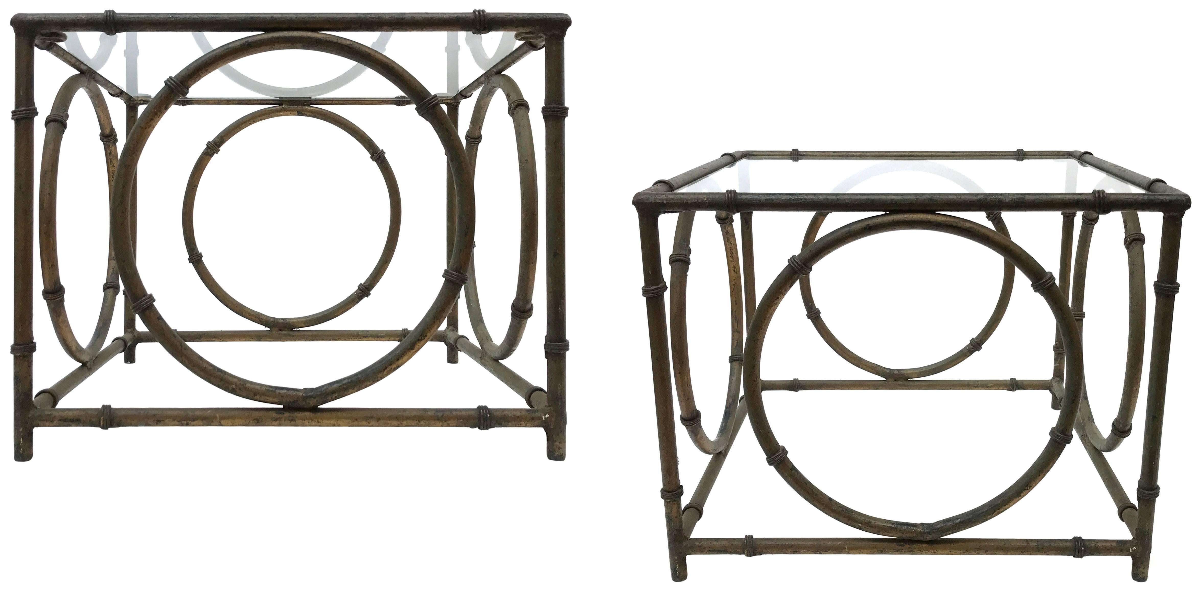A wonderful pair of Italian wrought-iron and glass side tables. Elegant faux-bamboo with an applied, faux-bronze patina beautifully mottled from years of life outdoors. Great from all angles. Classic forms with a subtly surreal and op-art presence: