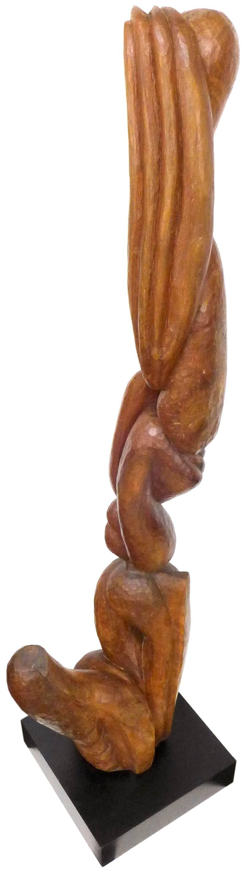 An outstanding abstract carved-wood sculpture. A beautifully crafted, towering, biomorphic pillar with an intriguing, wonderfully undulating surface; an assortment of secretive openings bored-through; a jutting, counterbalancing appendage at the