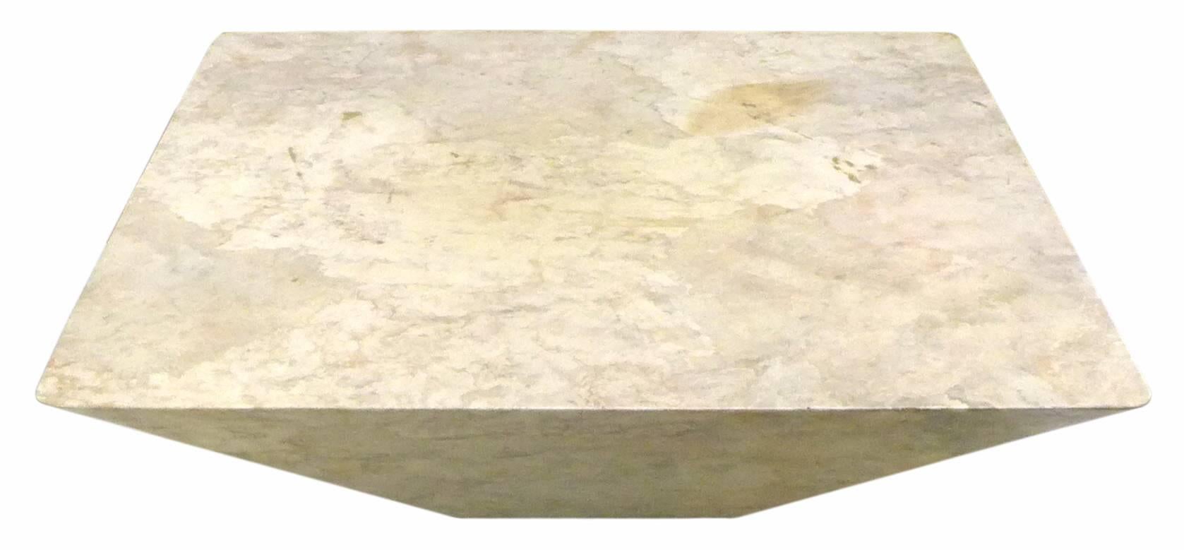 A wonderful and unusual geometric, faux-marble coffee table.  A dramatic, inverted-pyramidal form of fiberglass wearing an impressively executed, textured faux-marble surface.  Possibly custom-made, a rare and highly decorative utilitarian piece.  