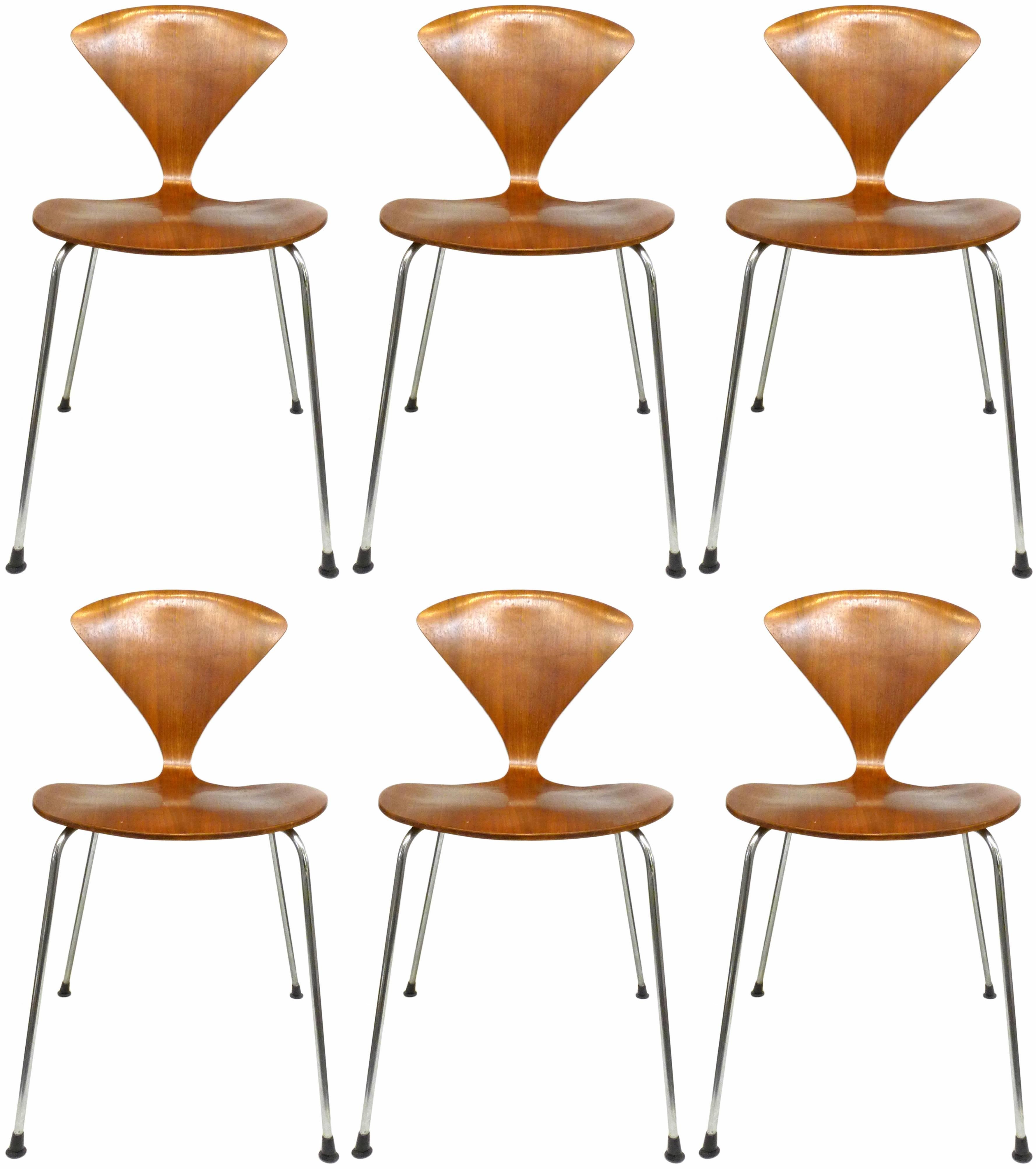A fantastic set of six vintage, metal-leg, stacking "Cherner Chairs" by Norman Cherner for Plycraft. A mainstay of mid-century design collections, including the Vitra Design Museum, a wonderfully-dramatic, molded-plywood seat on a slender,