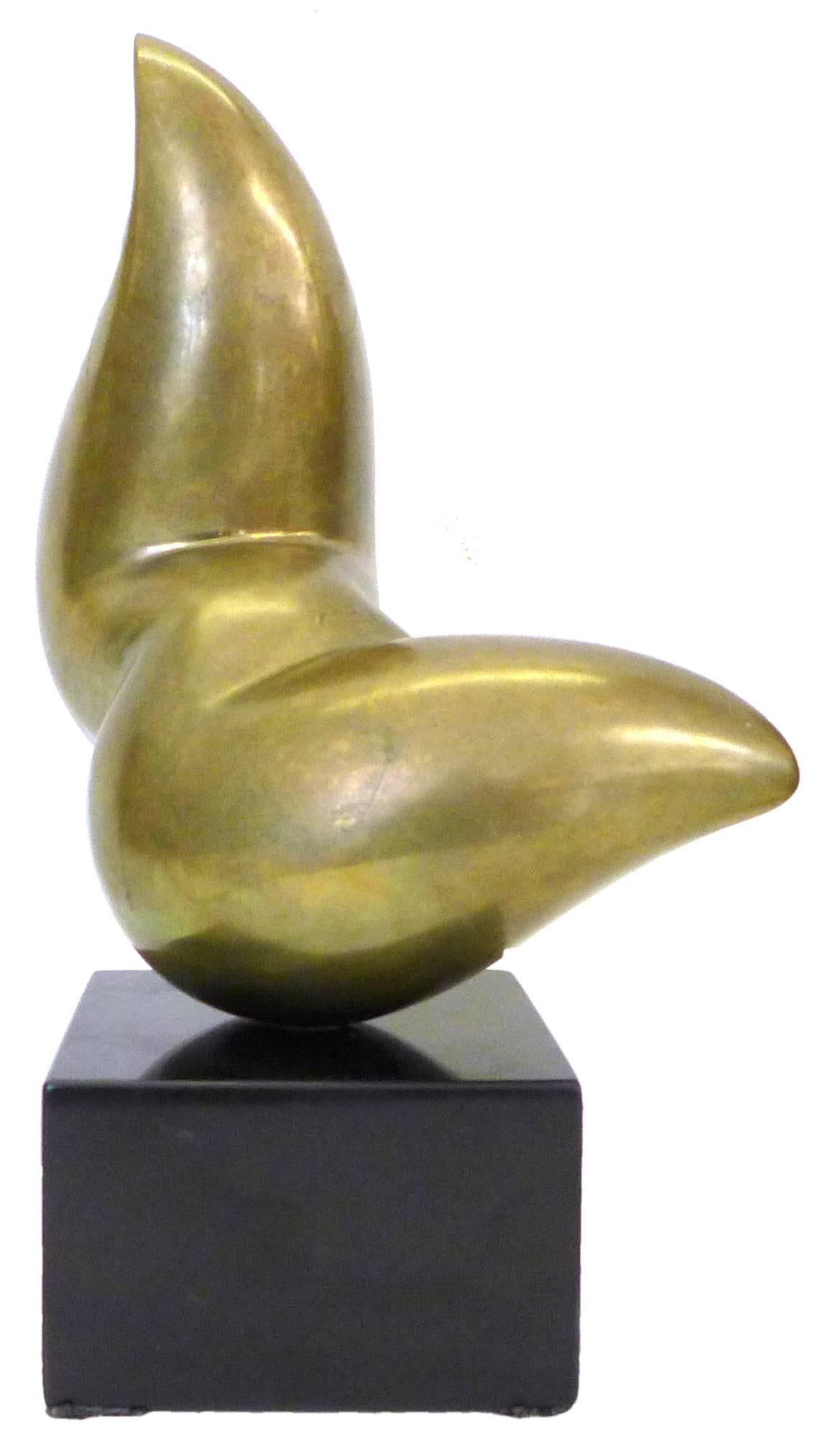 A wonderful, biomorphic, solid bronze sculpture.  A playful and elegant, fluid-like figure beautifully balanced, mounted to its original base, seemingly leaping upward.  An alluring creation, replete with fantastic, continuous lines and folds; great