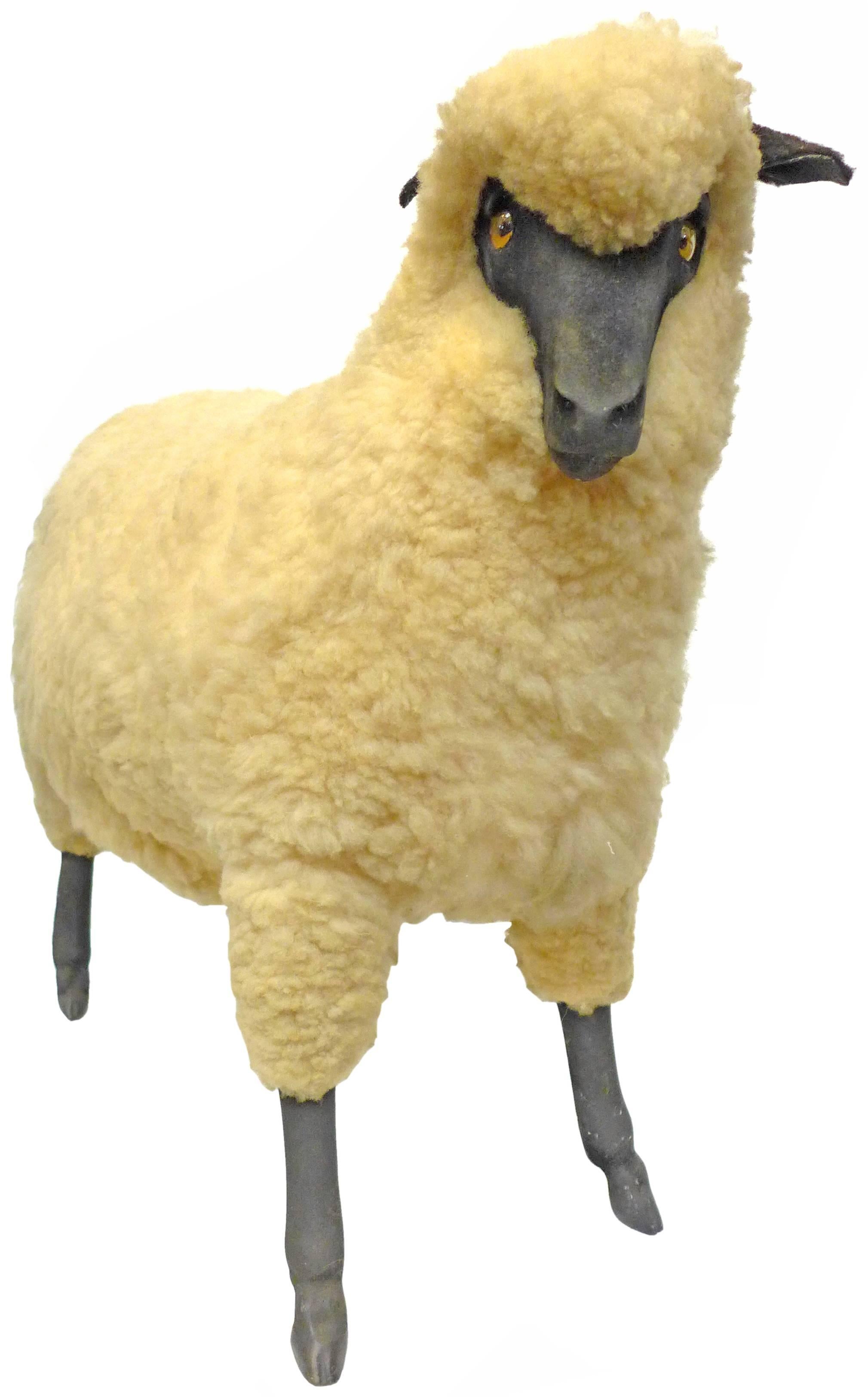 A fantastic, vintage sheep sculpture after those made famous by Francois Xavier Lalanne. Original sheep-shearling body with resin face and legs, felt ears, and acrylic eyes; a charming and playful, life-sized creature, perfectly captivating a