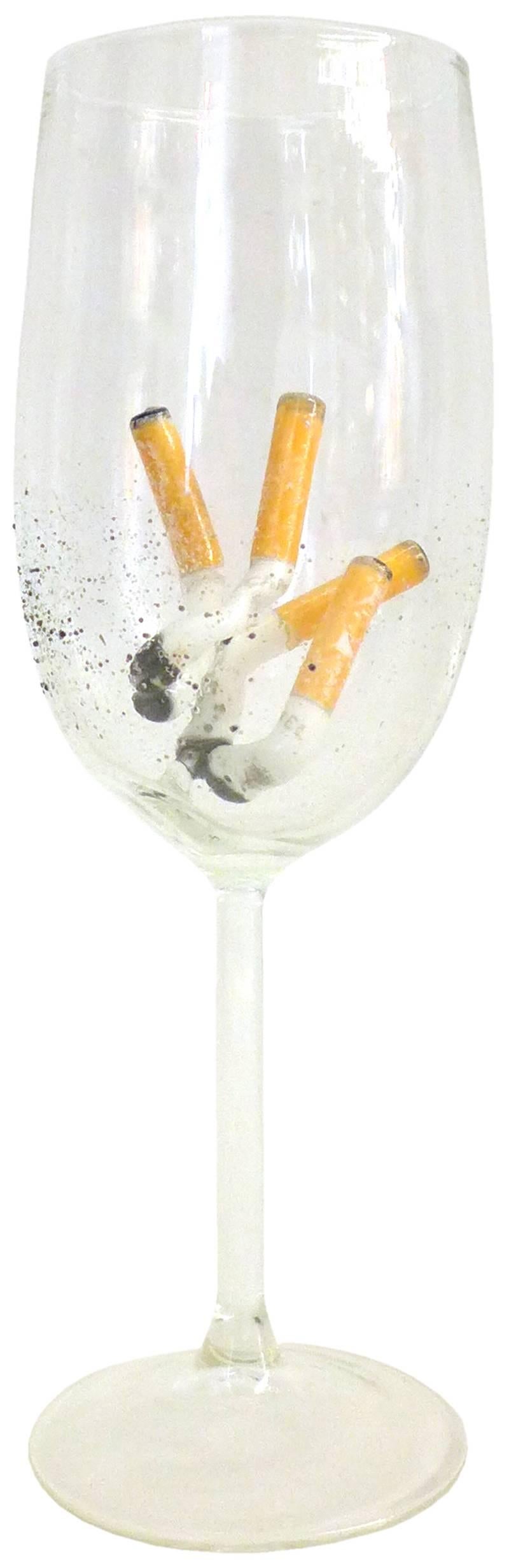 The bottom of the butt tastes better after wine (2015).
Horan’s blown glass-cigarette filled drinking vessels conceptually run parallel to previous sculptural works exploring the juxtaposition of beauty and the abject. Interested in a trompe l’oeil