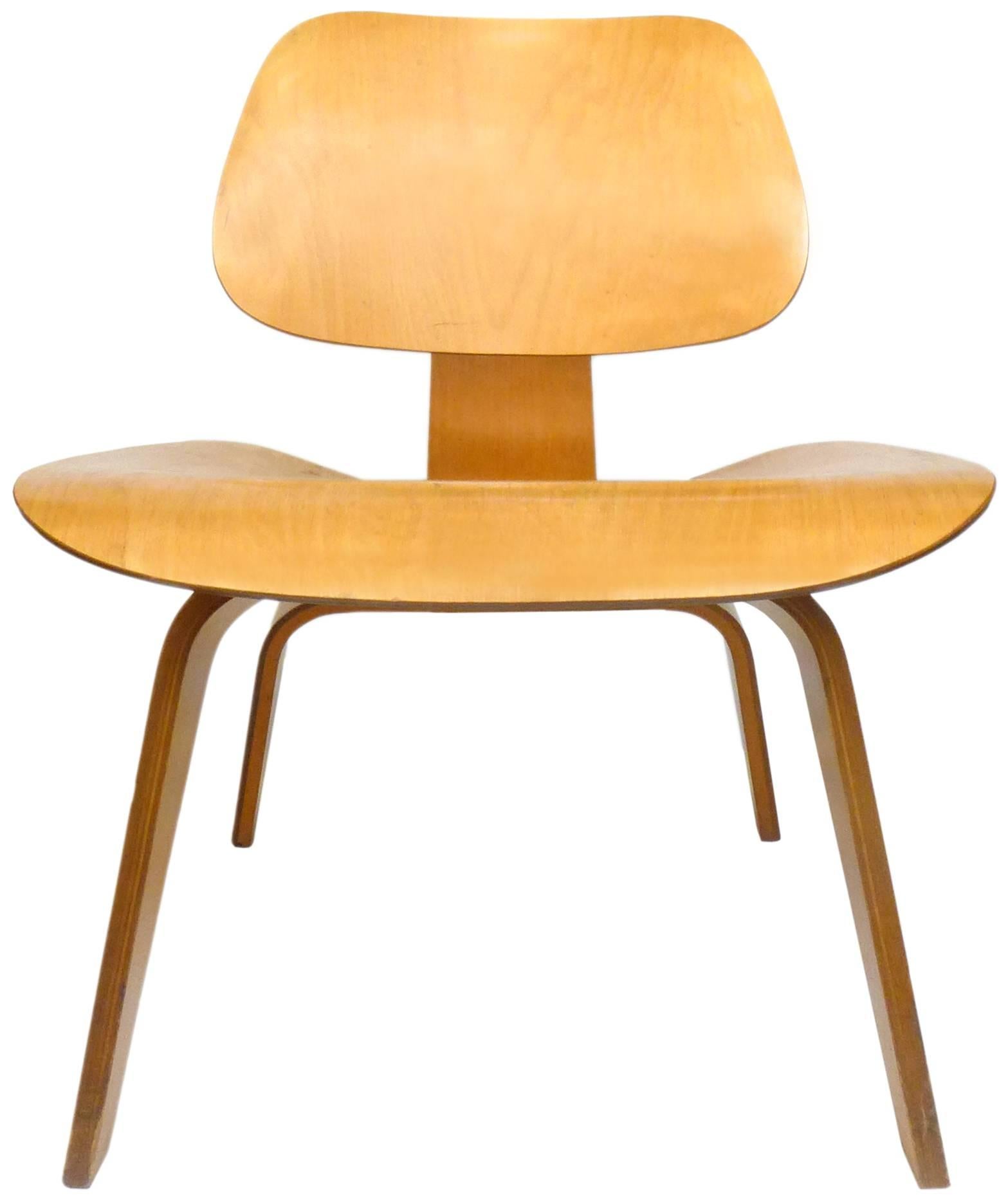 A wonderful, early, Charles Eames bentwood LCW (Lounge Chair Wood). Excellent all-original condition with shock-mounts and floor-glides all still solid and intact. Constructed of figured birch plywood with a beautiful, honey patina. An extremely