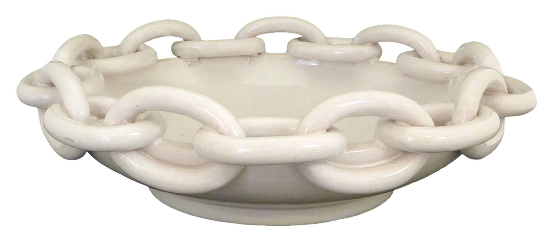 An elegant and subtly surreal ceramic chain bowl by ND Dolfi for Bergdorf Goodman.  Resplendent in an alluring, monochrome white glaze, an exceptional, utilitarian decorative object.
