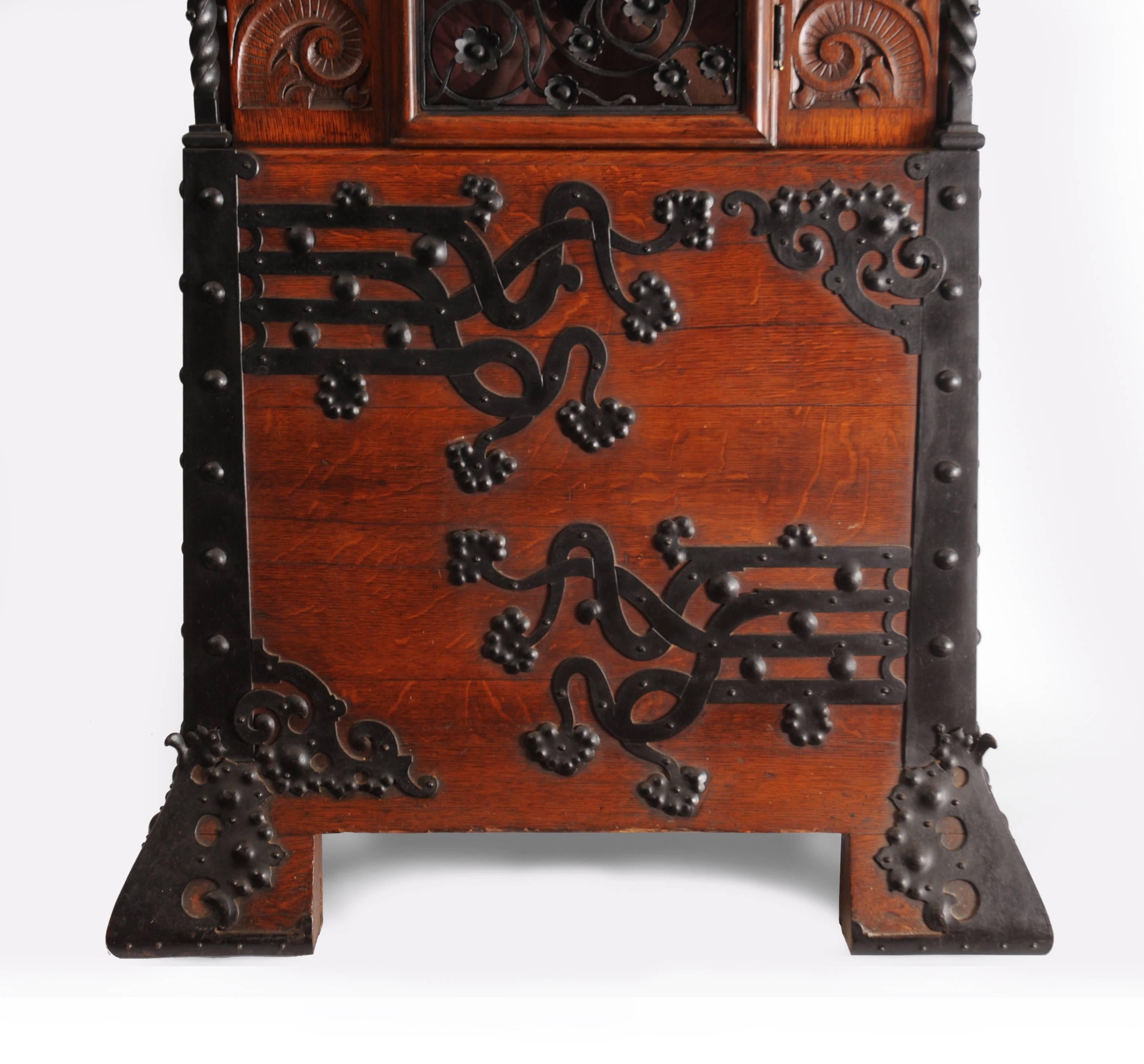 Carved Tall Aesthetic Movement Oak and Wrought Iron Case Clock For Sale