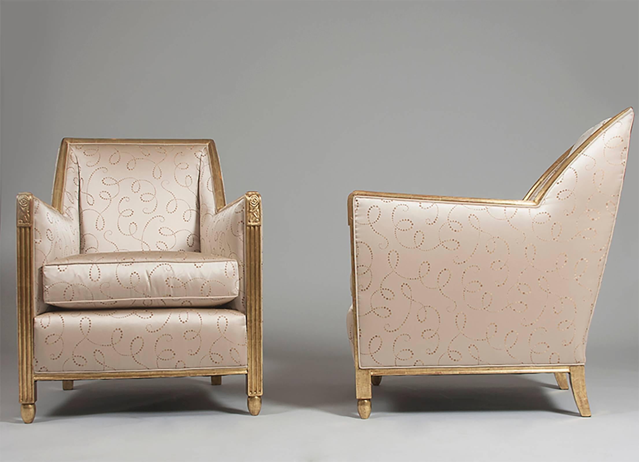 Pair of sculpted and gilt Art Deco armchairs.