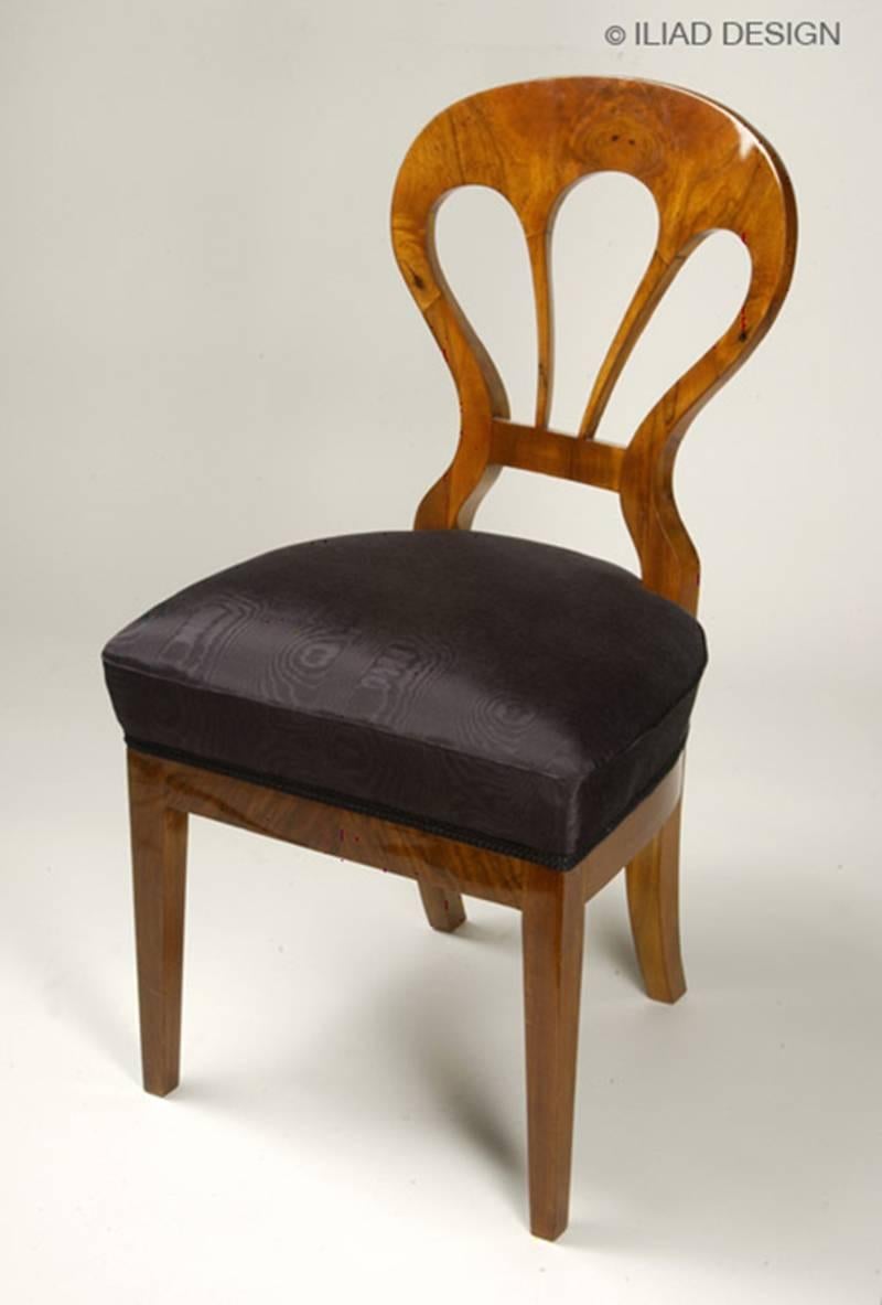 A set of six Biedermeier side chairs. Walnut veneer with a hand rubbed shellac finish.