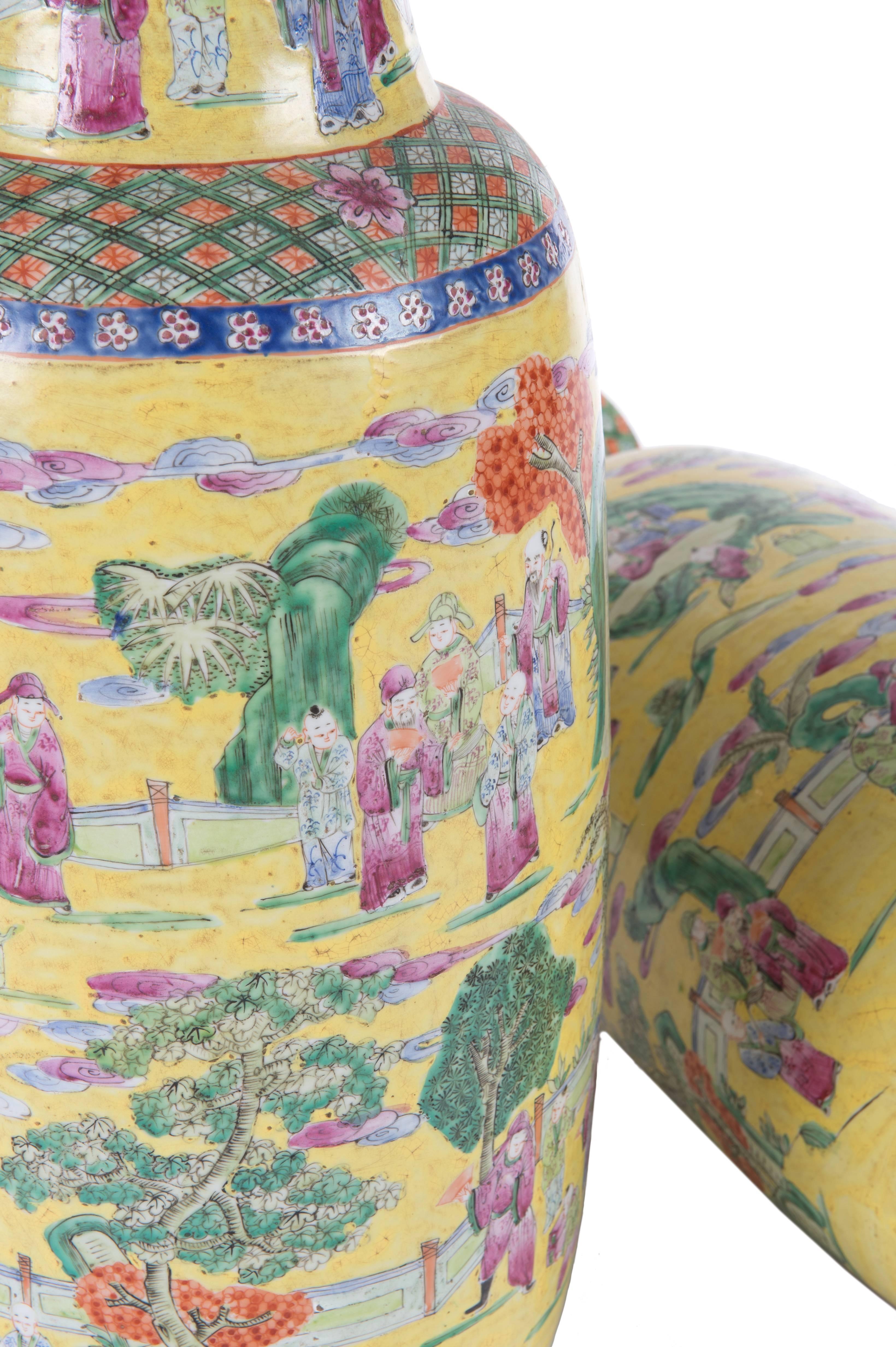 Extremely cheerful pair of late 19th century Chinese vases with the most unusual yellow background decorated with figures.